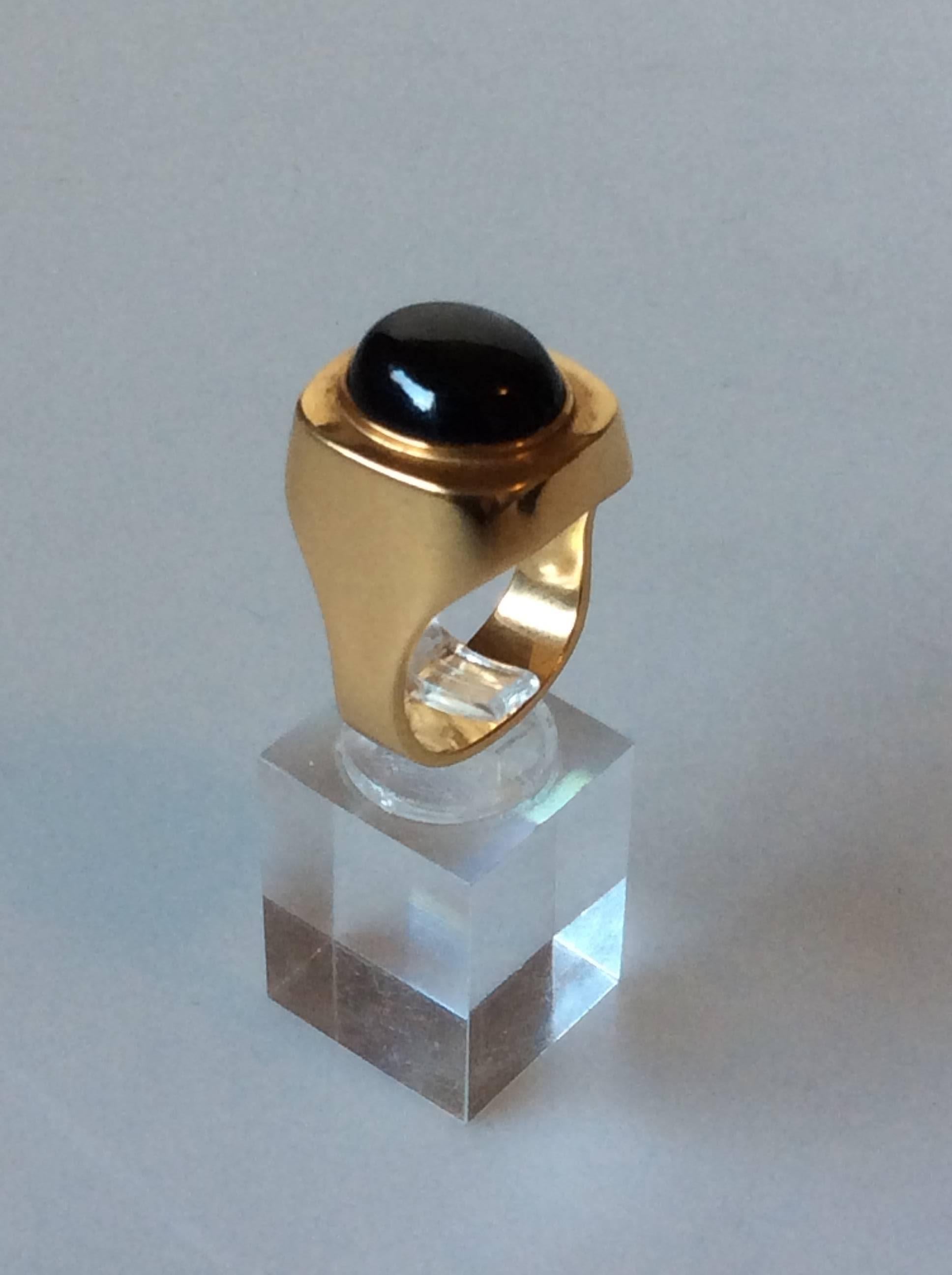 Georg Jensen 18K Gold ring with cabochon star sapphire.

Ring size 61 or US 9 1/2