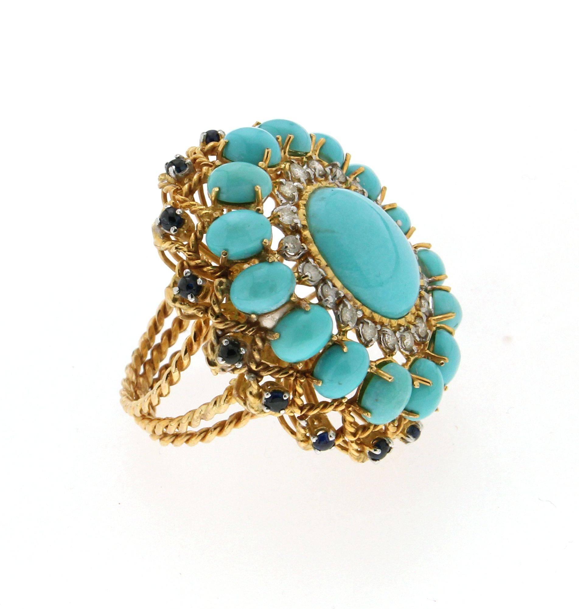Fabulous turquoise ring,yellow gold 14 carat with diamonds and sapphires, turquoise 
from Arizona US

Ring Weight 19.30 gr
Diamonds 0.56 ct
Sapphires 1.22 ct
Turquoise 4.30 gr
Ring Size 7.5 us
Diameter 1,70 cm 0,66 inch
