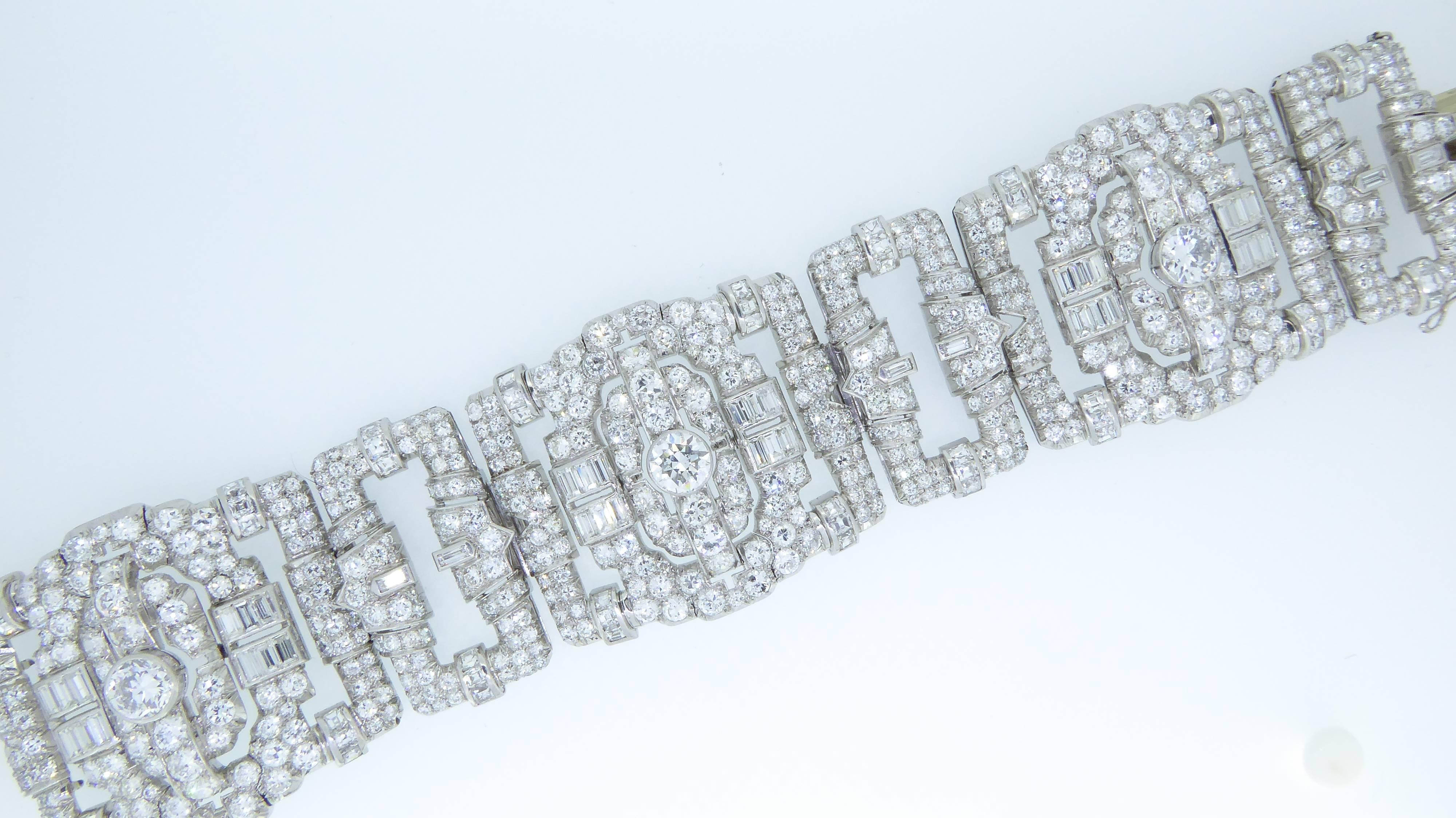 An Art Deco platinum and diamond bracelet. Circa 1930s. With three large rectangular openwork links and three smaller links pave and channel-set with brilliant and baguette-cut diamonds. Estimated 35 carats of diamonds in total, including three