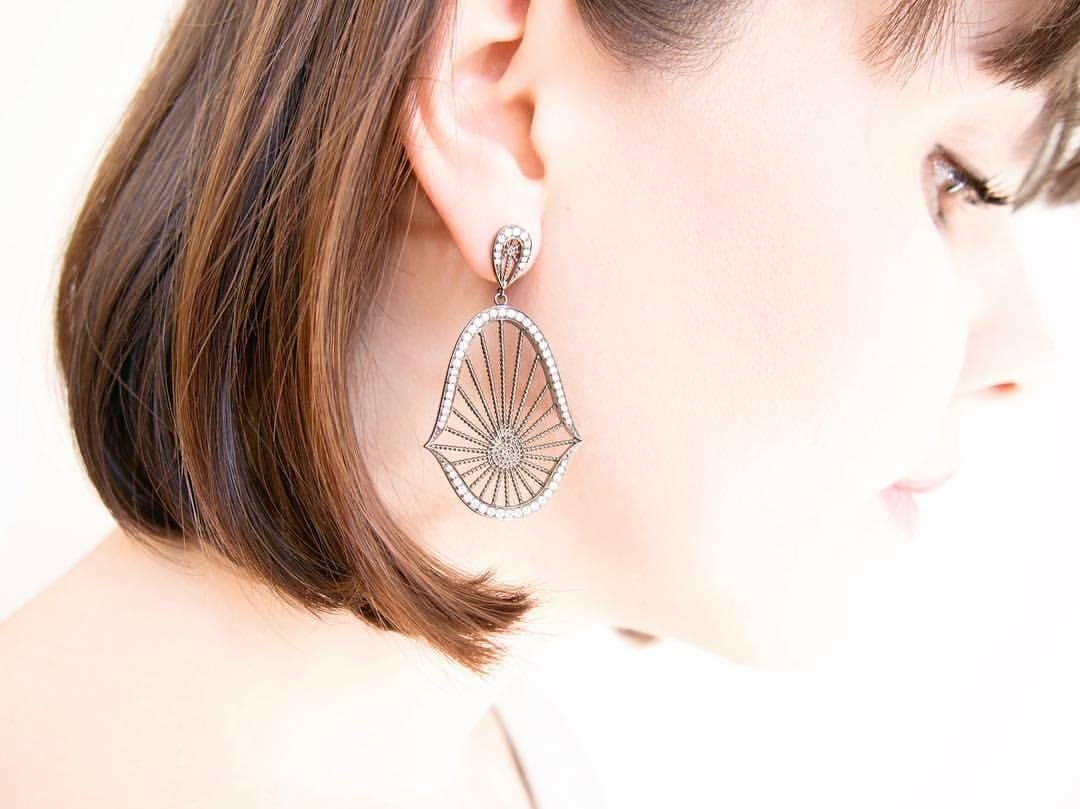 An ASSYA must have, these gorgeous statement earrings in silver rhodium are set with 1.7ct sparkling white diamonds, colour G, VS1.  Inspired by the beauty of the oriental lotus flower, they will add glamour and elegance to any outfit.

