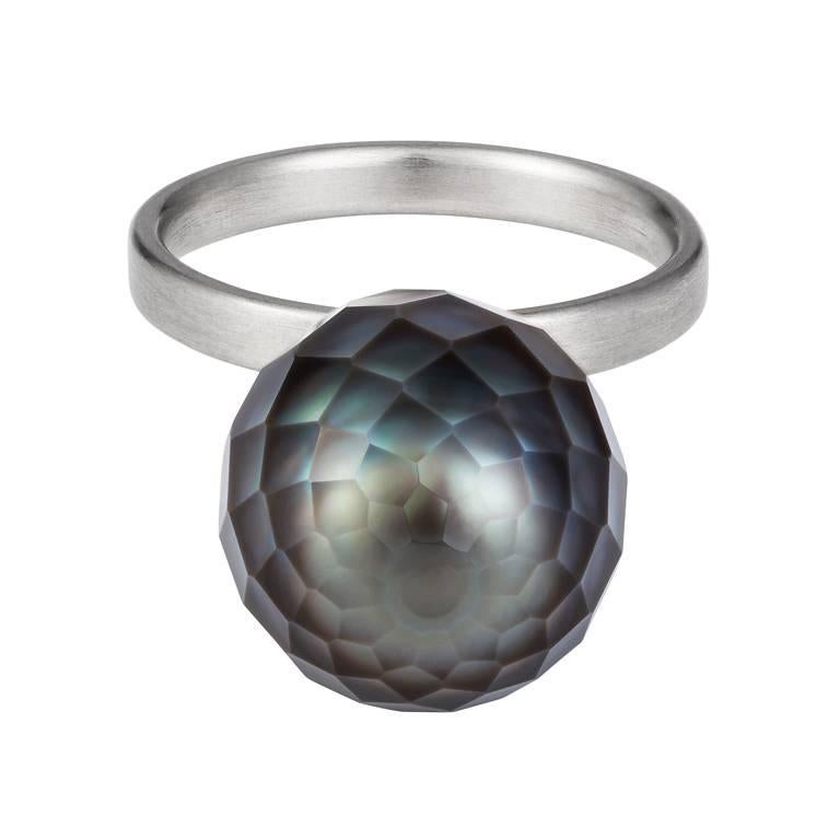 This 18k white gold ring is fabulously fun and unique. With this rare faceted balloon shaped black Tatihian pearl it makes for a show-stopping cocktail ring. The pearl is 13mm x 19mm and rests upon a 2.5mm wide band with a brushed satin finish. This