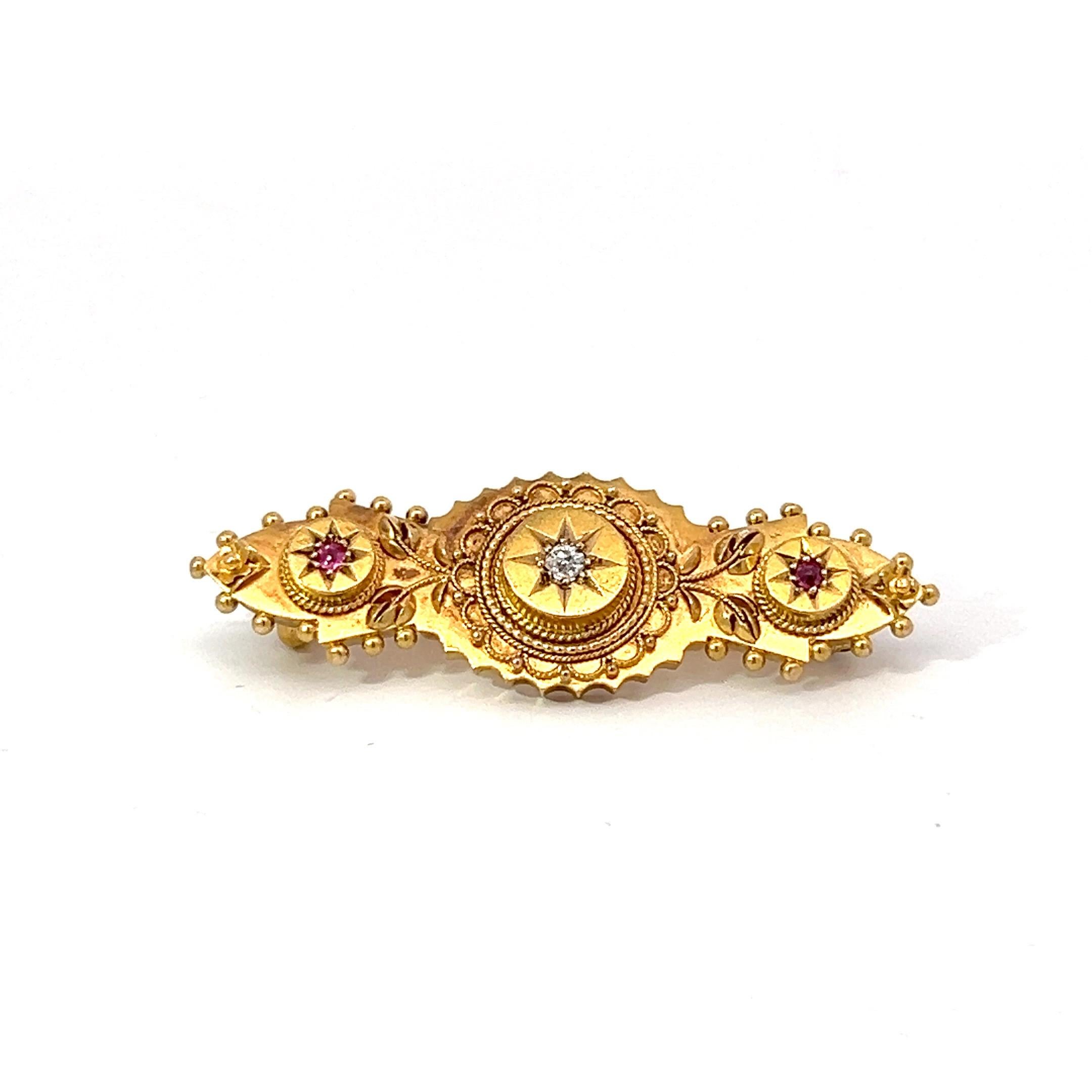 Unusual and fine antique Victorian brooch handcrafted in 15 karat yellow gold composed of 3 decorative floral section featuring an approximate 0.10 carat diamond old European round cut claw - prong set in a deep star shaped design, and with smaller
