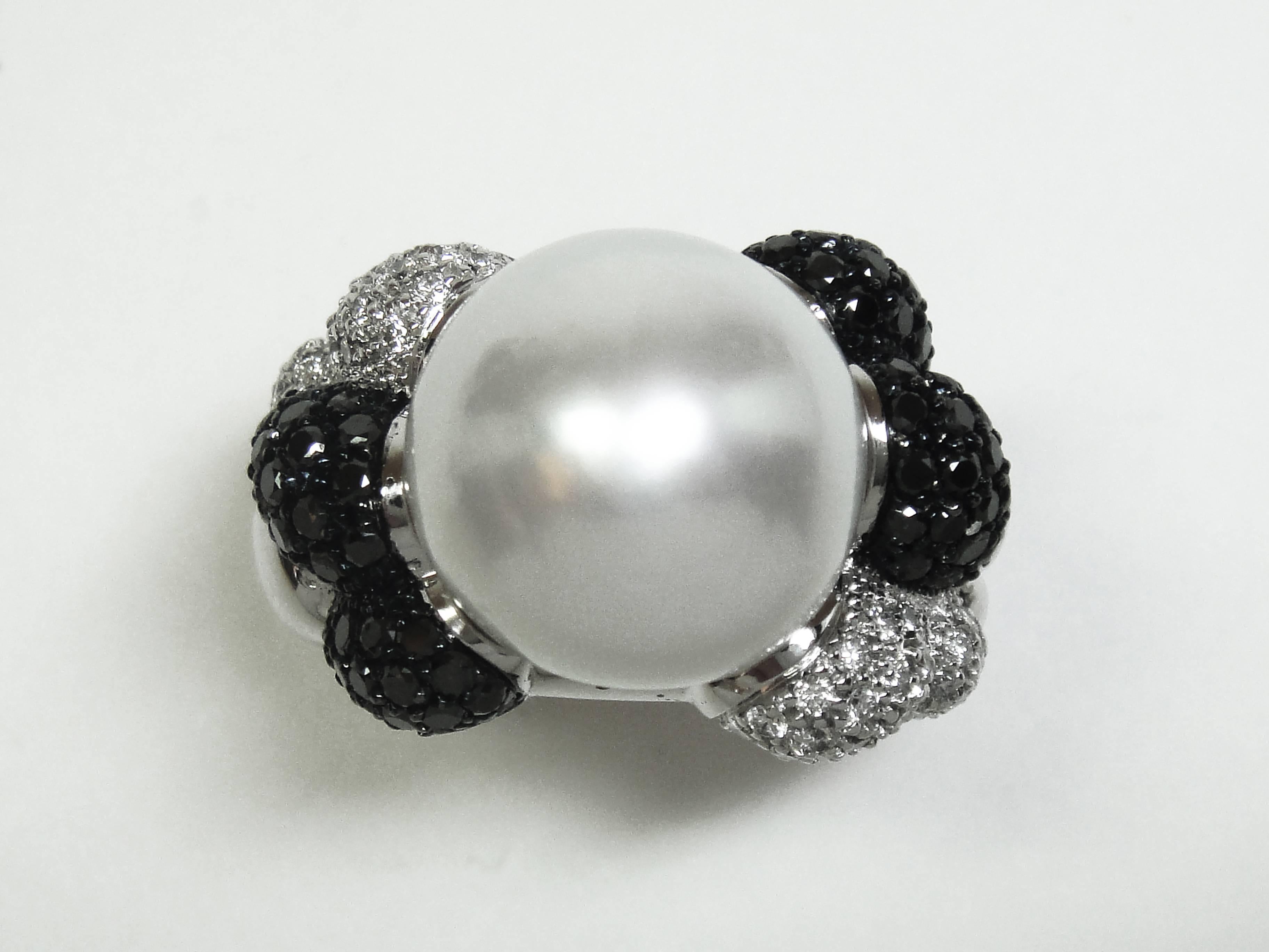 This cocktail ring is handcrafted in white 19.2K gold with a beautiful South Sea Cultured Pearl and set with black and white diamonds. This piece is designed by Monseo and manufactured by Monseo artisans in Porto, Portugal.

Currently out of stock.