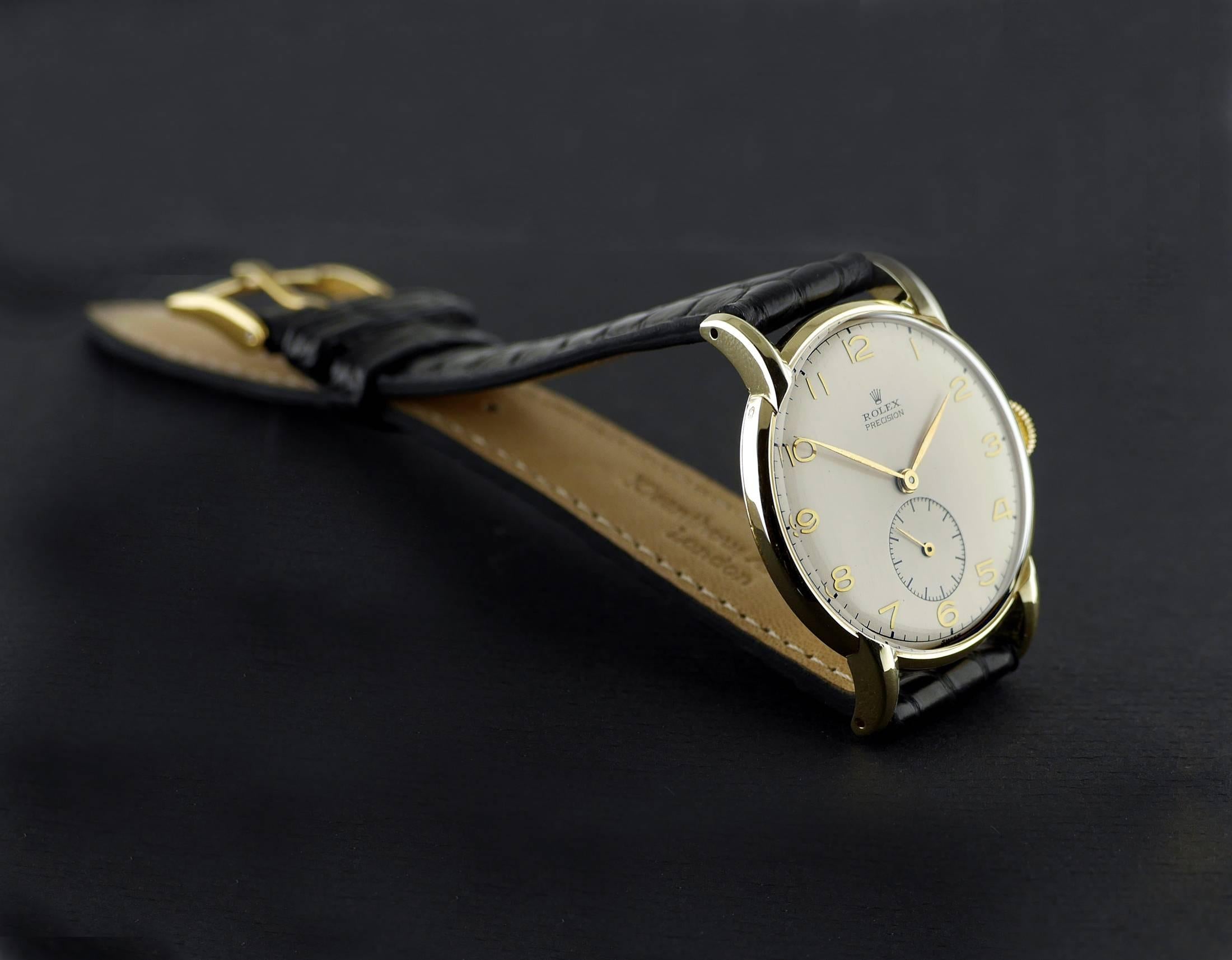 Rolex Precision:: 14 Karat Gold:: um 1945. 1
