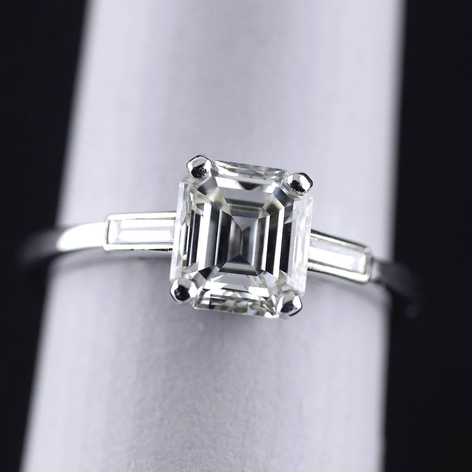 Platinum Art Deco vintage handmade Emerald Cut Diamond ring circa 1930.

1.61ct Emerald cut diamond, H/I, Vs1, set on a Platinum shank. With two baguette diamonds on the shoulders of approx 0.25ct H/I, Vs1 (total weight). British Gemmological