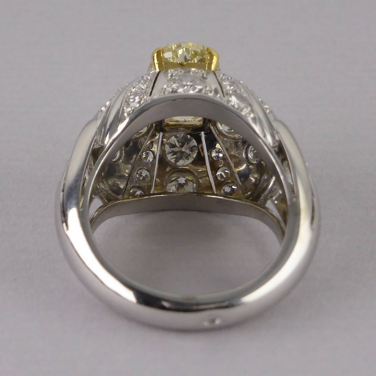 Oval Cut Certified Fancy Yellow Untreated Diamond 2.11 Carat Gold Bombe Ring, circa 1960
