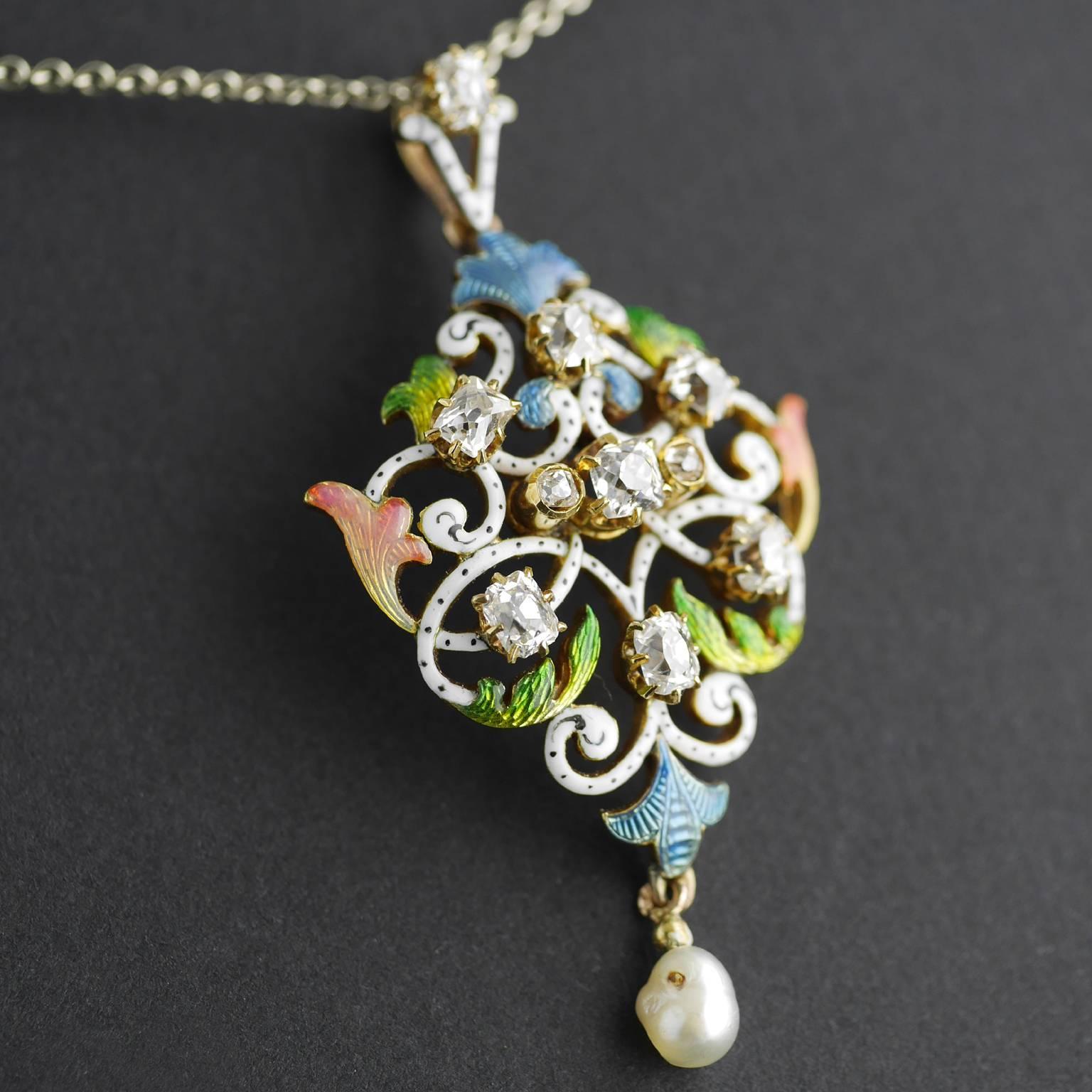 An exquisite, rare and fine Art Nouveau pendant in 18 carat gold, Circa 1900.

18 carat gold set with translucent varicoloured Guilloché enamel with a natural salt water pearl drop.

Eight  principle diamonds, Georgian Table Cut (Very early from