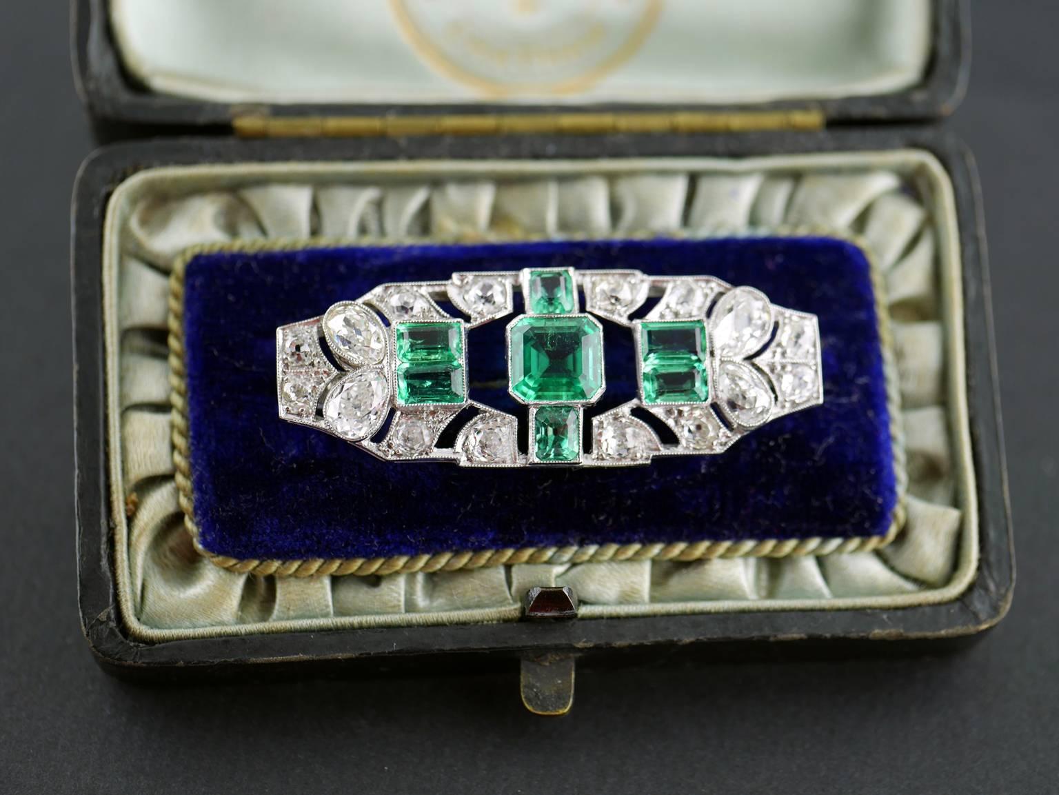 Art Deco emerald and diamond brooch mounted in platinum circa 1930

Central emerald 1.70 carats Certificated, Colombian, natural colour with minor clarity enhancement. Surrounded on each side with a total of 6 emeralds approx weight 4.5 carats.

The