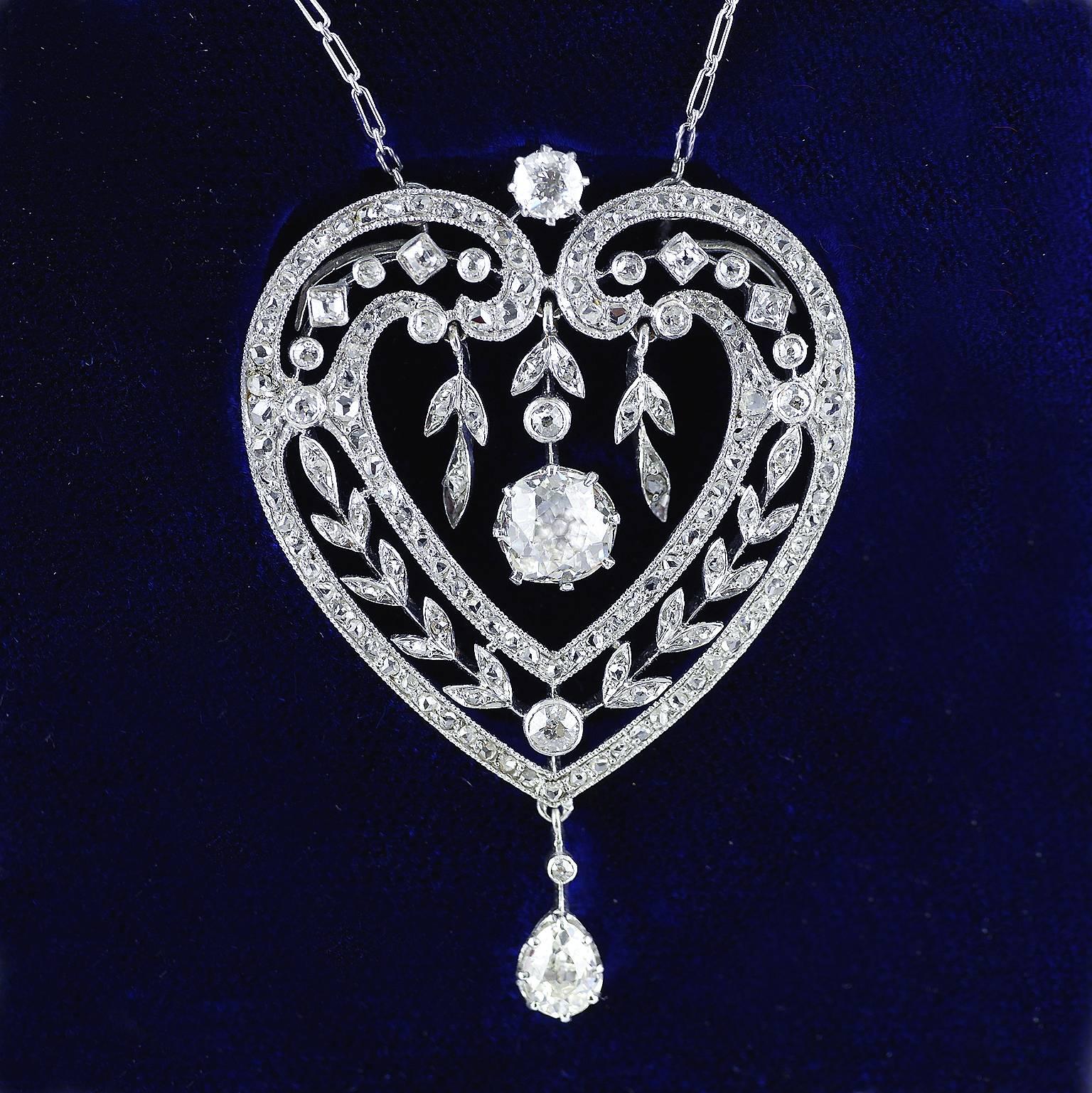 Platinum & Diamond Belle Epoque Heart shaped Pendant dated circa 1910 on a platinum chain.

Articulated central diamond drop, 1.10ct, I, VS2  (Certificated) with two articulated leaf design diamond set drops to either side. Articulated pear shaped