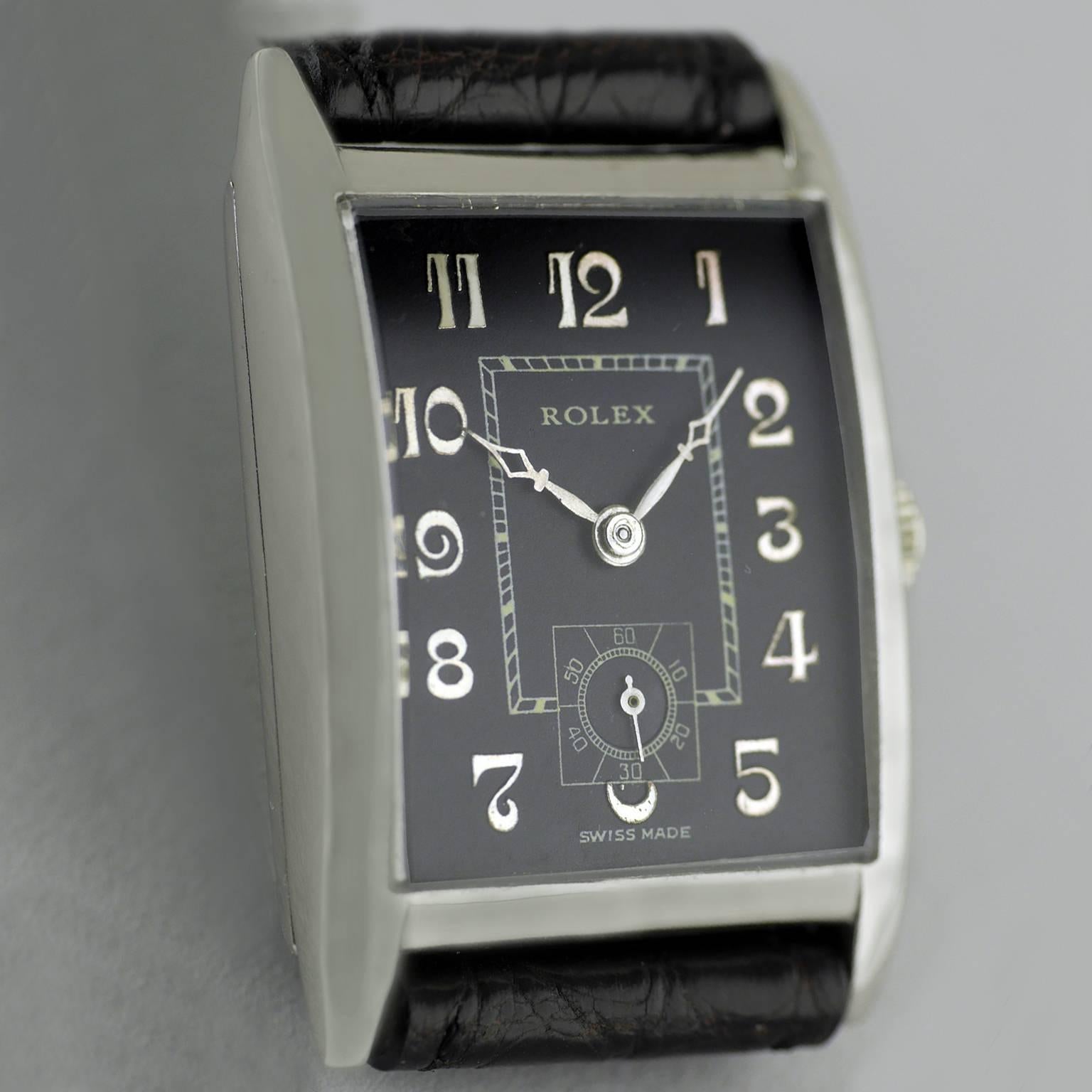 A rare black dial Art Deco vintage wristwatch by Rolex dated 1930.

Sterling silver rectangular shaped case marked Rolex and “RWC LTD” for the Rolex Watch Company Ltd and “25 World’s Records”. Hallmarked for Glasgow import into the United Kingdom in