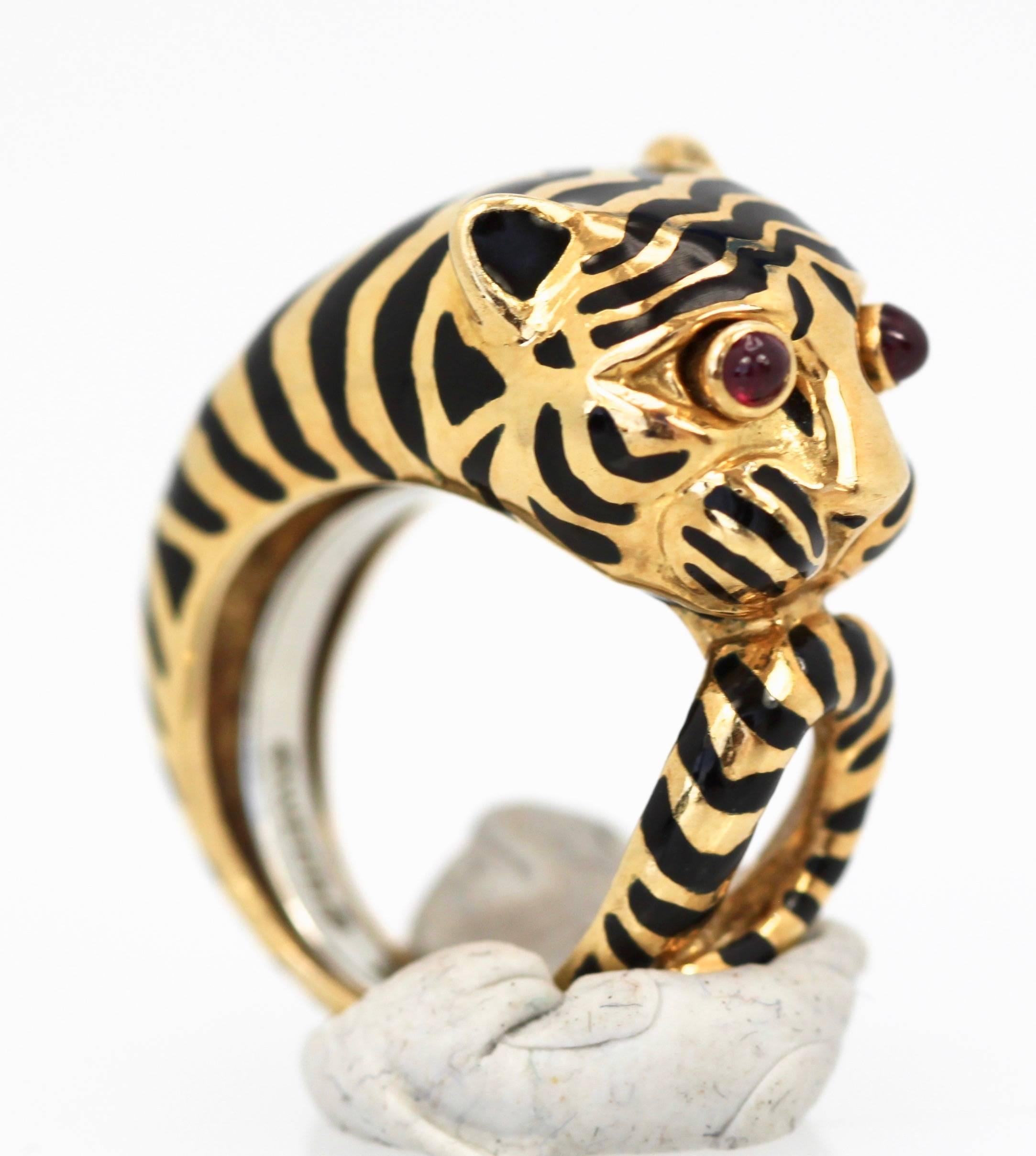 This gorgeous David Webb ring is from the animal collection and is currently selling and in current production. It is a beauty the black enamel stripes are in very very good condition with just a bit of enamel loss on one spot which is not