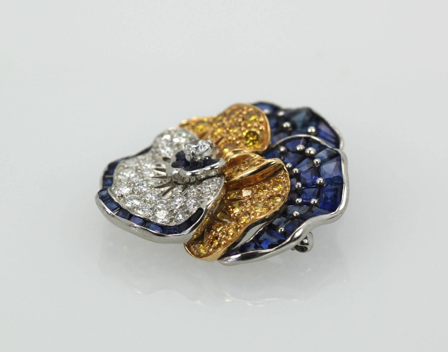 This Oscar Heyman Pansy is one of the most coveted brooches to own.  It set with calibrated blue Sapphires brilliant cut, colorless Diamonds and brilliant cut treated yellow Diamonds.  It measures 36mm x 32mm and weighs 20 grams.  I suggest making a