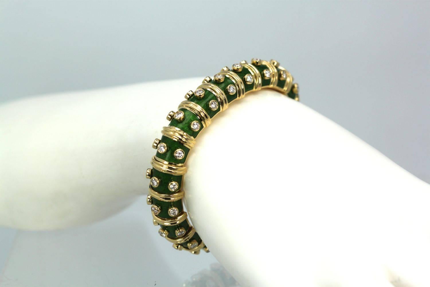 This Schulmberger bracelet is an iconic dream.  Done in gorgeous green enamel with 60 DEF and VS Diamonds to total 3.00 carats with a secure clasp.  This bracelet is used but in excellent condition.  There is no enamel loss the segments are in
