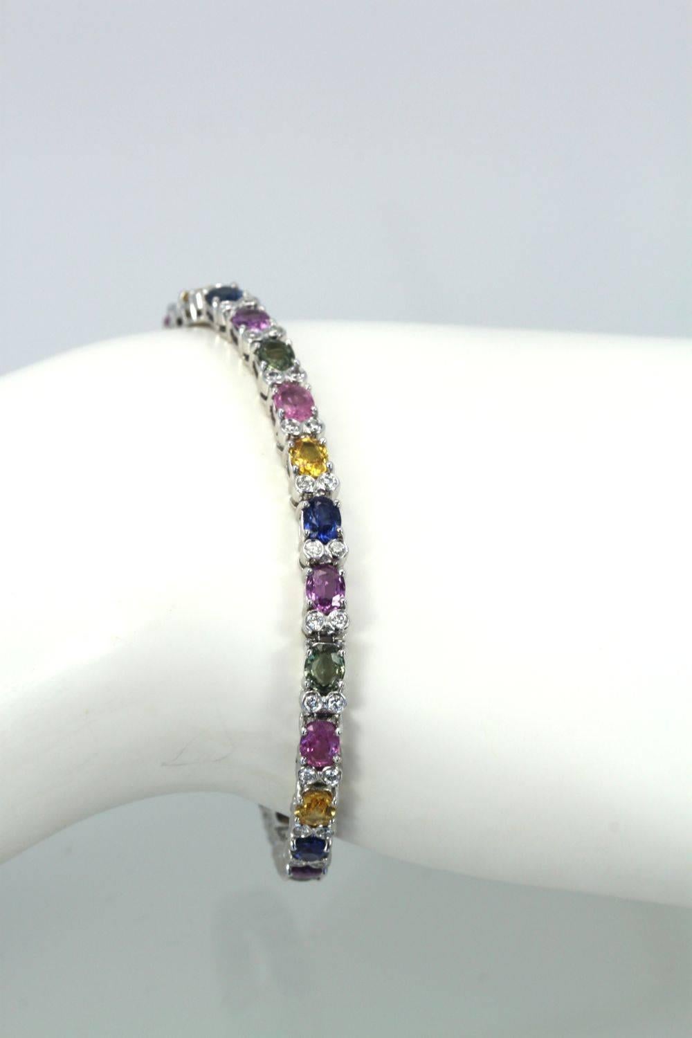 This Multi Colored Sapphire and Diamond Bracelet goes beautifully with the multi colored sapphire long chain and the tassel earrings in another listing. I just love fancy colored Sapphires as the number of colors they come in is just astounding!  I