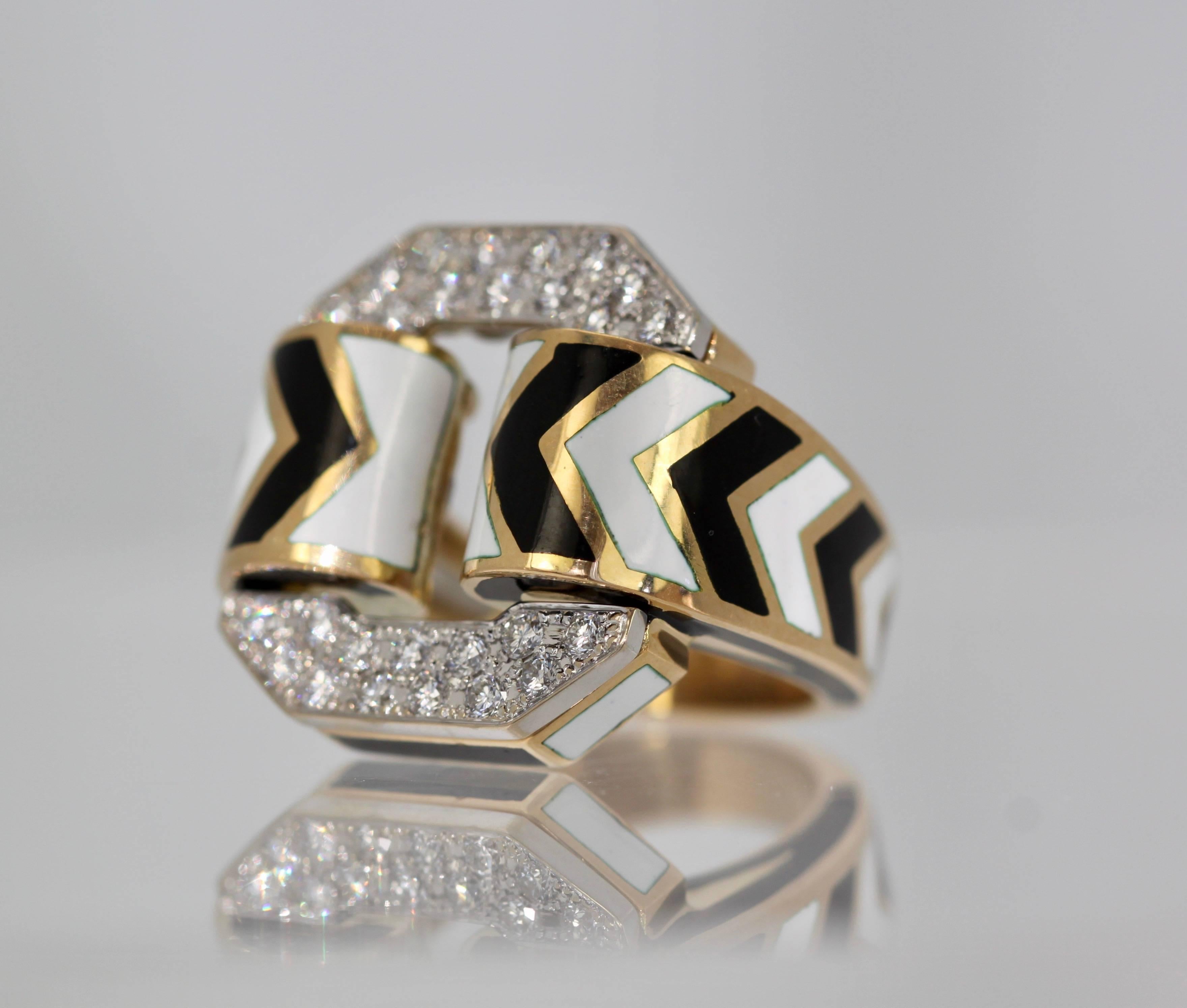 Gorgeous David Webb Iconic Buckle ring in Zebra print.  I have owned many of these buckle rings, black enamel, white enamel and zebra enamel which happens to be my favorite.  This ring is substantial and heavy and of course the diamonds are the best