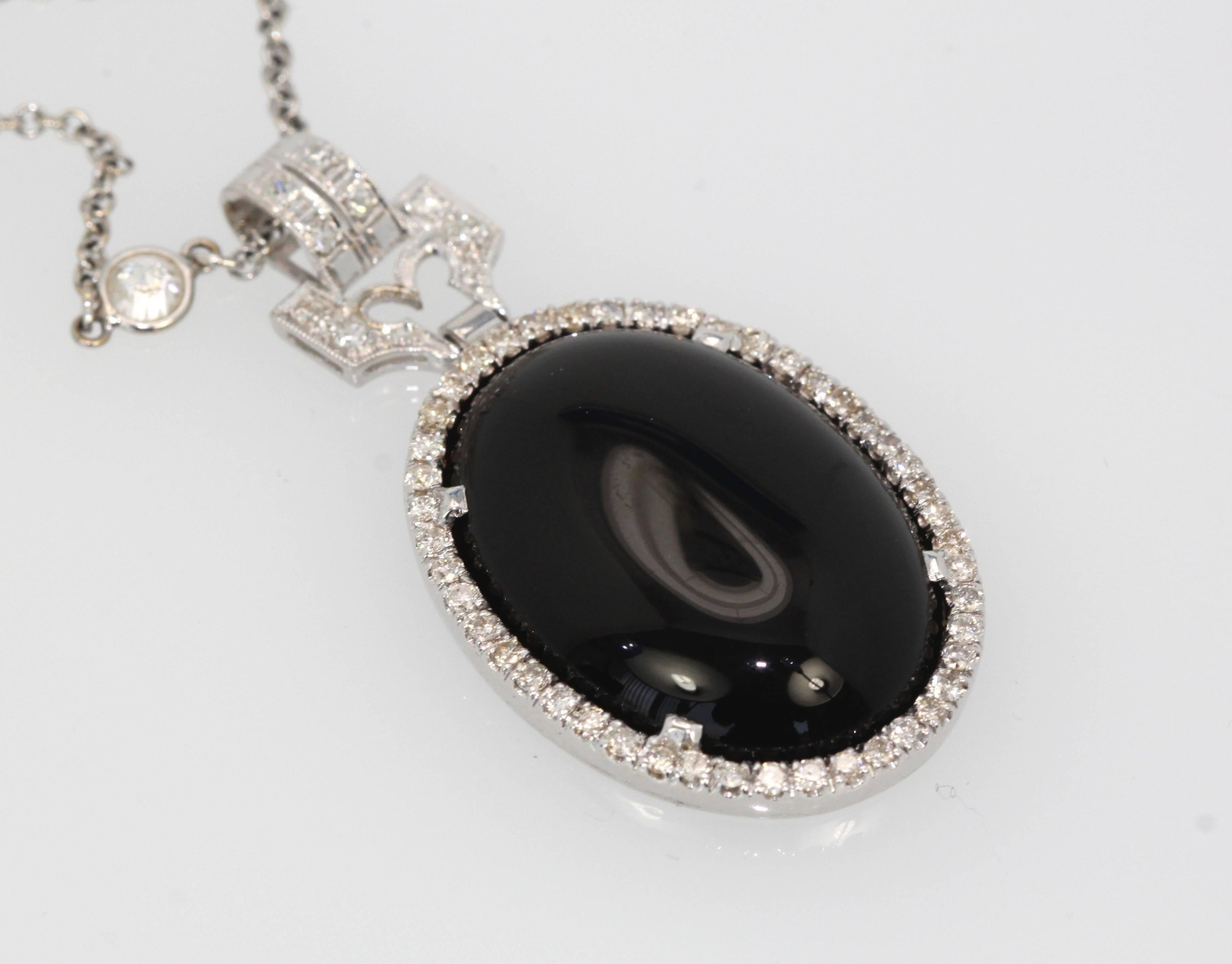 This Art Deco Onyx Platinum Pendant has 1.50 carats in the Diamond Surround.  The Onyx Plaque is  2.9 cm
This simple onyx Pendant works with almost anything you wear.  The Diamonds are G-H VS2-SI1.  The onyx has a high shine and brilliant. I