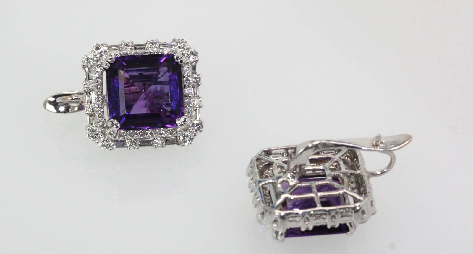 These earrings are made from 2 emerald cut Amethyst Stones approximately 4 carats each to total 8 carats with a Diamond Surround.
There are about 2 carats of very white G color Diamonds both round and baguette that surround these gorgeous amethysts.
