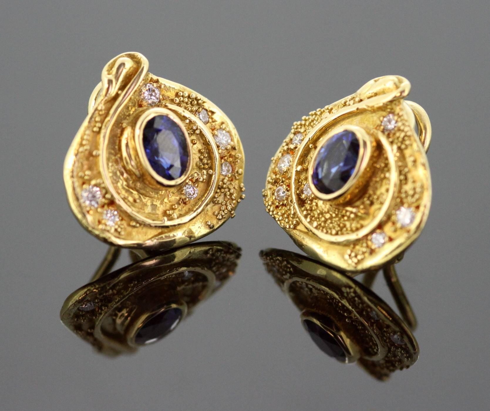 Vintage 18K Yellow Gold Clip on Earrings With Blue Sapphire (1 CT Total) and Diamonds (0.22 CT Total) 
Designer : Elizabeth Gage 
London 2006 
Fully hallmarked. 

Dimensions - 
Size : 1.8 x 1.8 x 1 cm 
Weight : 11 grams total 

Condition :General