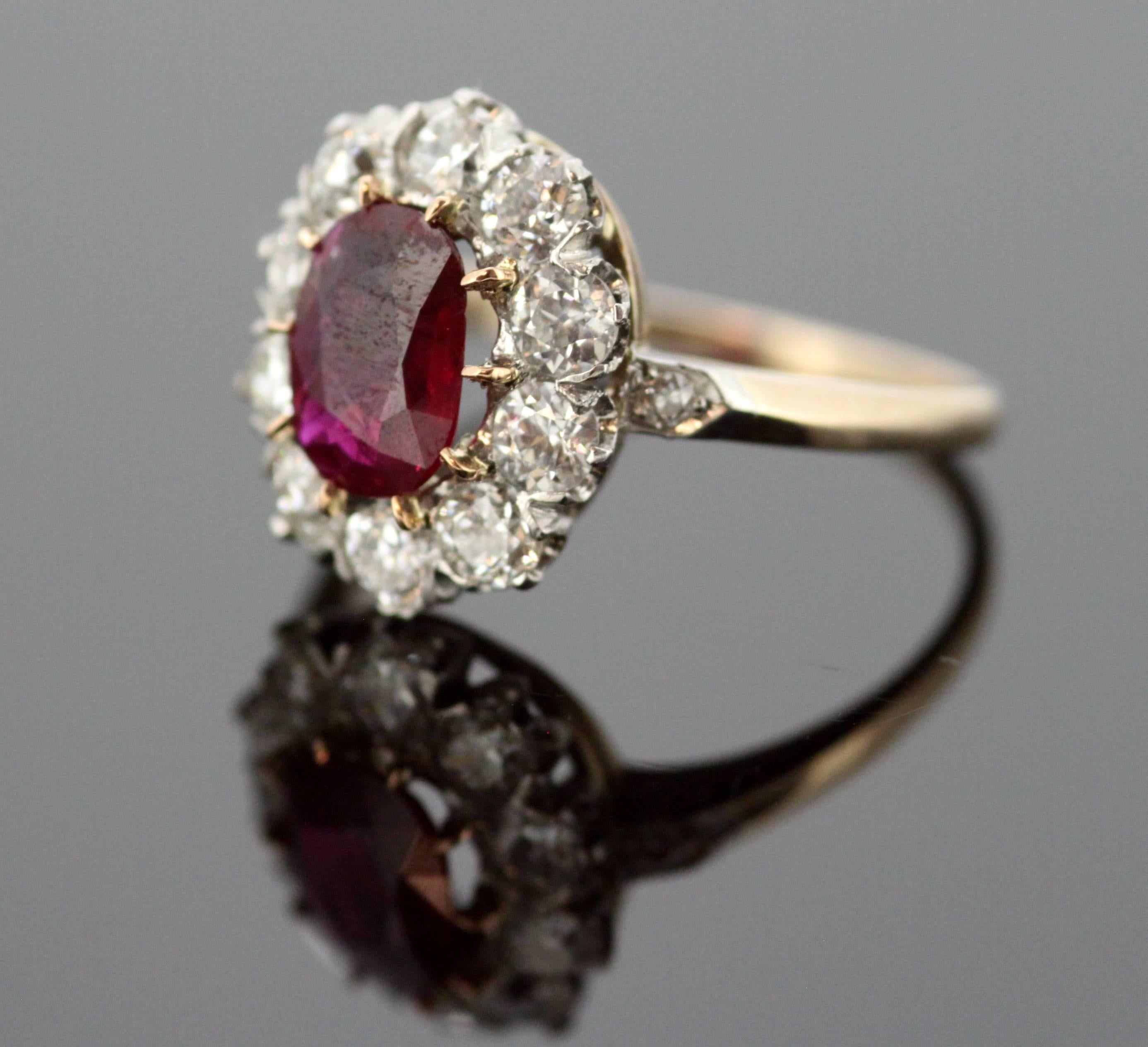 Vintage 18K yellow gold ladies ring with oval cut ruby (1 CT) and diamonds (0.72 CT Total)
Hallmarked 18K
Circa.1970s


Dimensions -
Ring Size : 2.5 x 2 x 1.5 cm
Finger Size : (UK) = O (US) = 7 1/2 (EU) = 55 1/4
Weight : 4 grams total

Ruby - 
Cut :