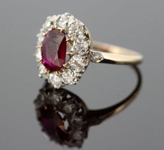 18 Karat Yellow Gold Oval Ruby Diamond Cluster Ring, circa 1970s