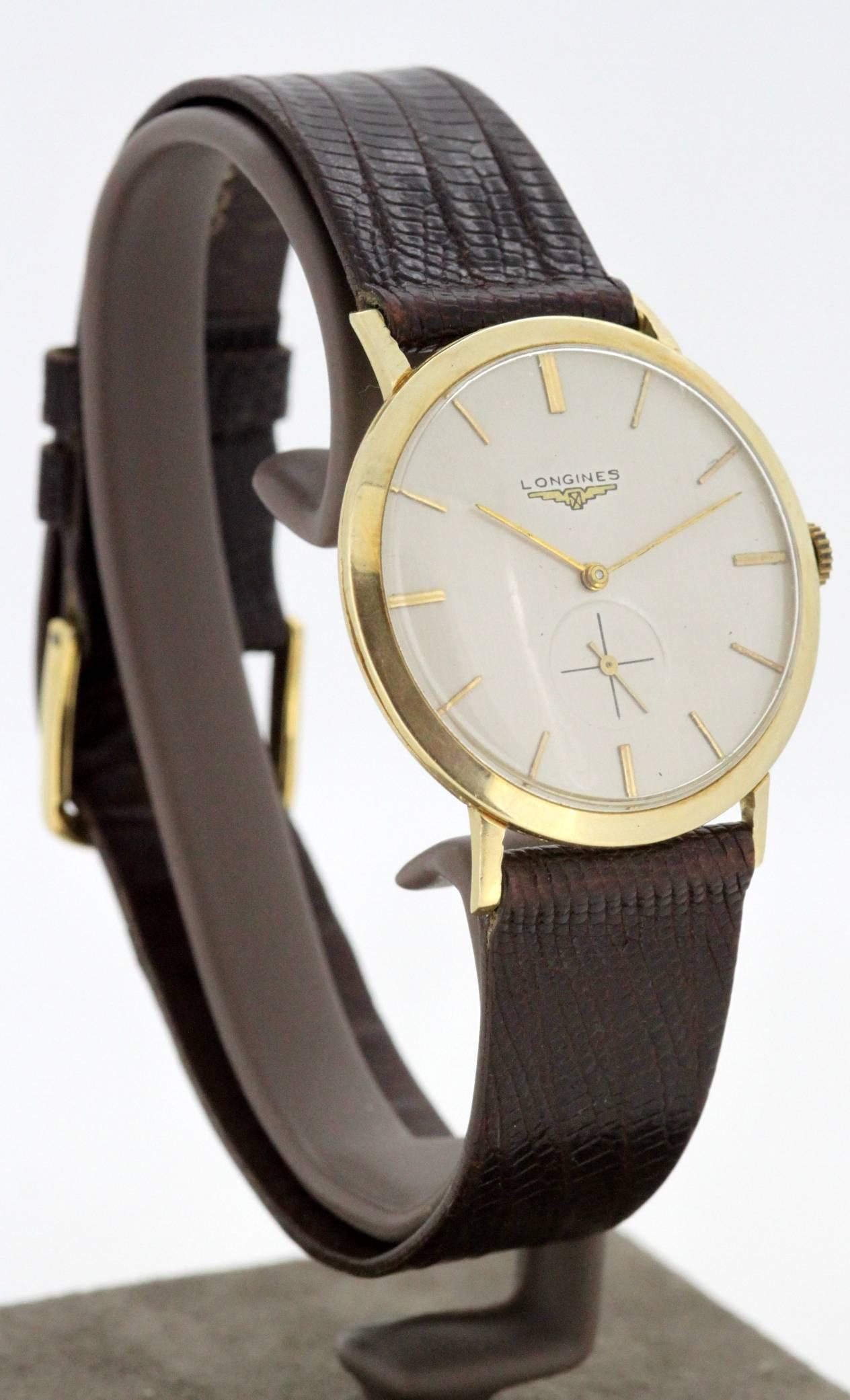 Vintage Longines 14K Yellow Gold Mens Wristwatch
Circa.1960's

Gender: Mens
Case size: 37 x 34  mm
Movement: Manual Winding
Watchband Material: Leather
Case material : 14K Gold
Display Type:	Analogue	
Dial: ( See Photos )
Hands: Gold
Clasp : Strap