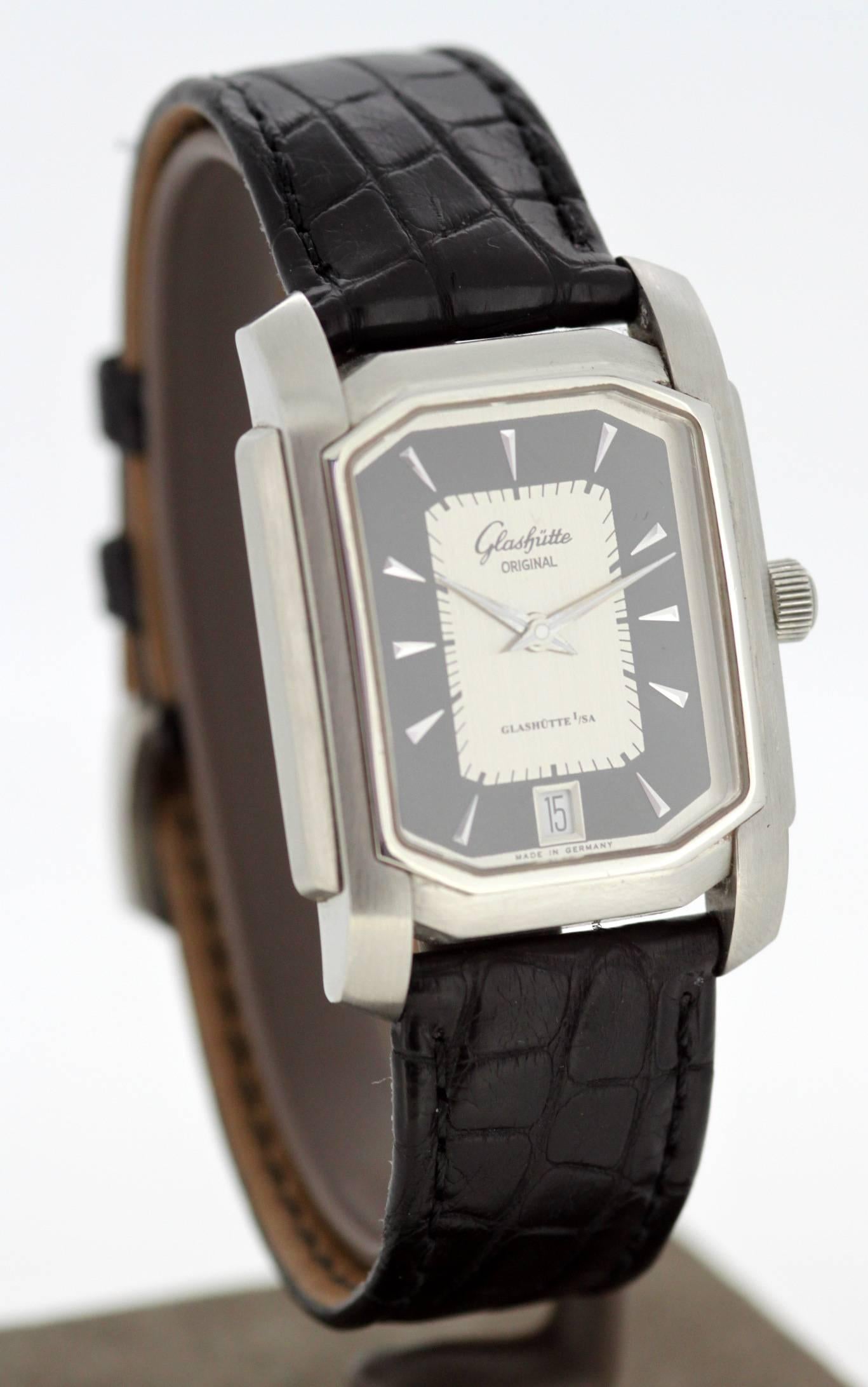 Glashutte Original 1/SA Stainless Steel Watch

Gender: Mens
Approx Case size: 42 x 33.5 mm
Movement: Automatic
Watchband Material: Leather
Case material : Steel
Display Type:	Analogue
Dial: Black and Grey ( See Photos )
Hands: Steel & Luminous
Clasp