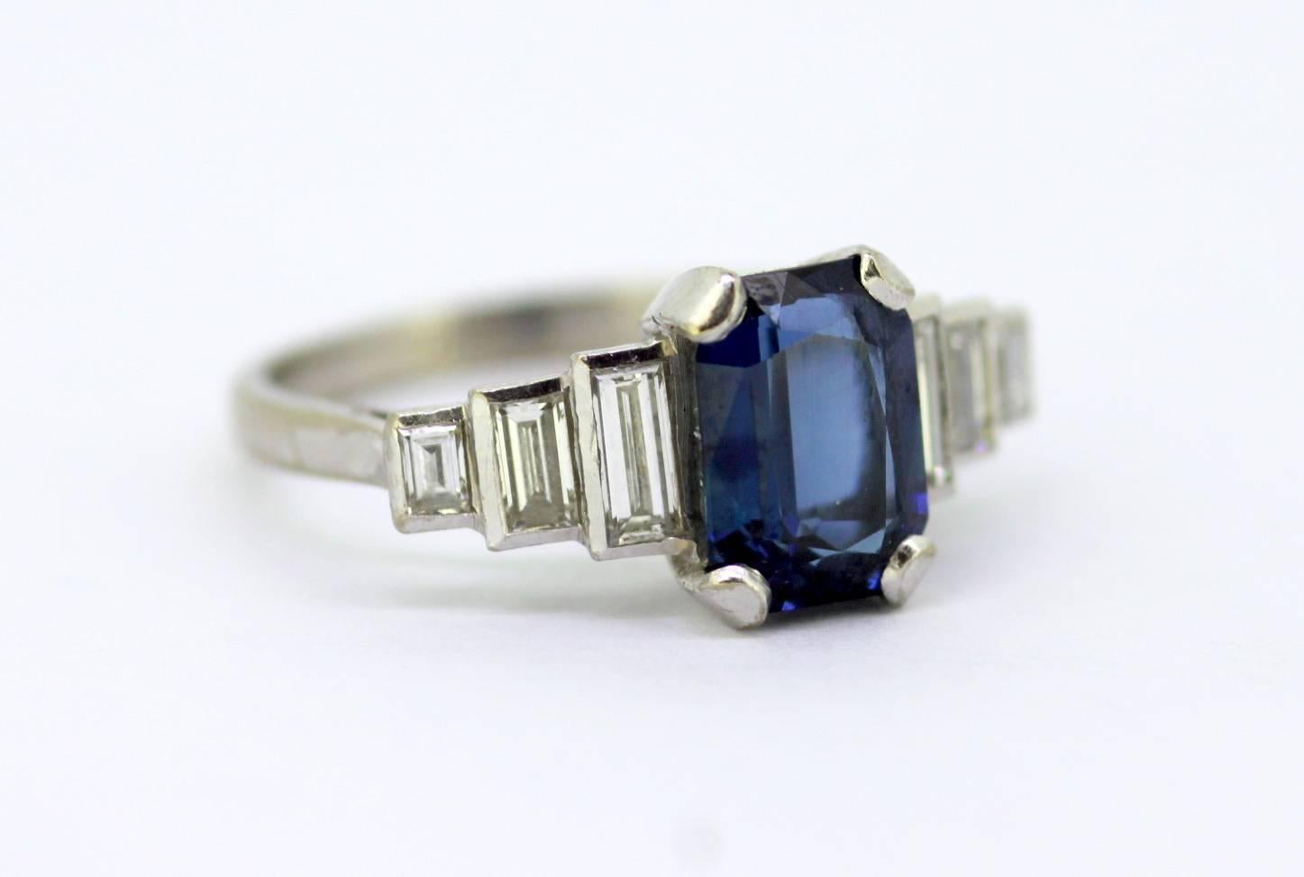 Vintage 18k white gold ladies ring with blue sapphire & diamonds,
c.1970's

Dimensions -
Finger Size: (UK) = M (US) = 6 1/2 (EU) = 52 1/2
Weight: 4 g
Ring Size : 2.4 x 2 x 0.95 cm

Diamond - 
Cut : Baguette
Number of Diamonds : 6
Carrat : 0.36 CT