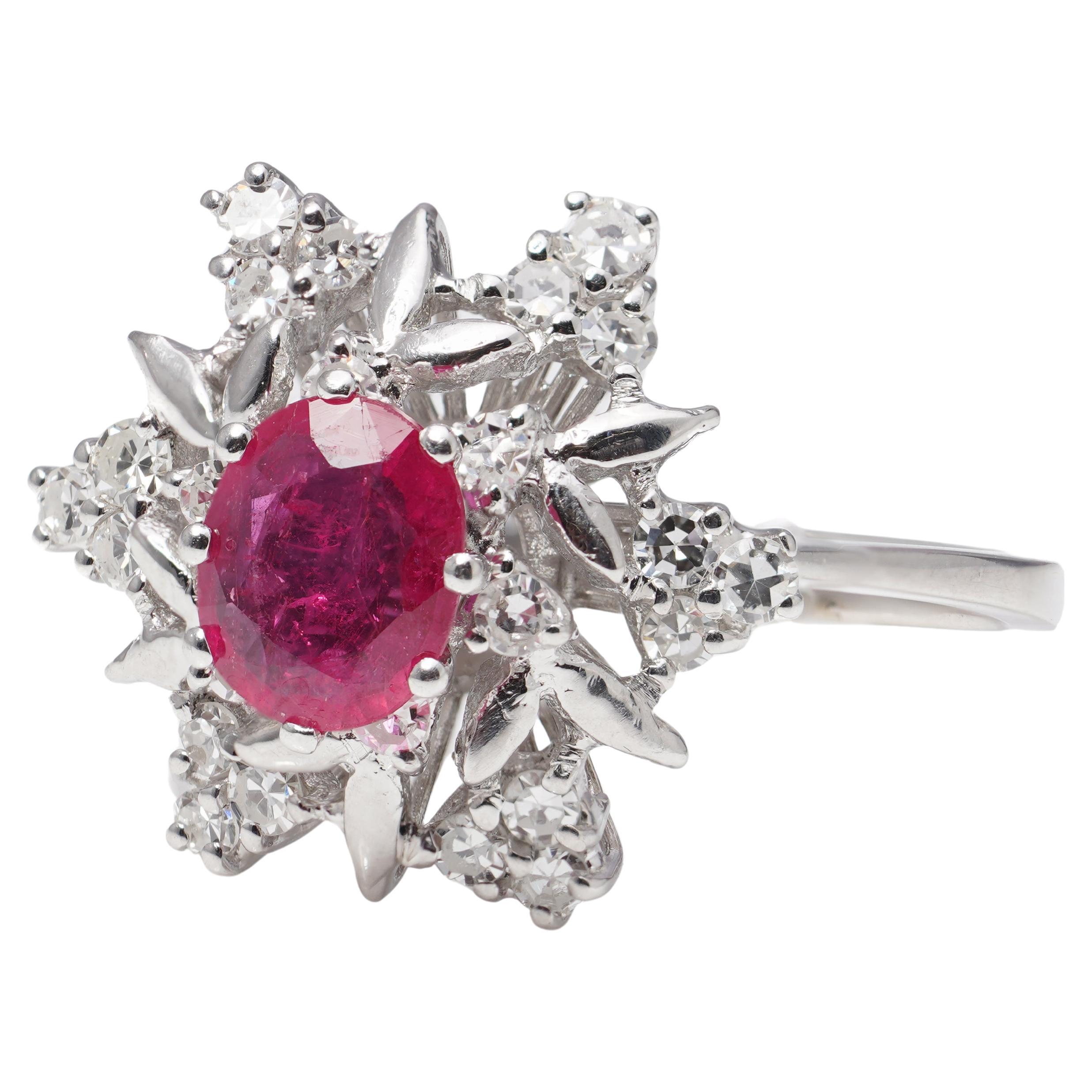 Looking for a cluster ring that's dripping in vintage glamour? Introducing our vintage 18kt. white gold 1.00 ct. ruby cluster ring! This beautiful piece is surrounded by 0.72 cts. of brilliant-cut diamonds.
With a timeless flower cluster design,