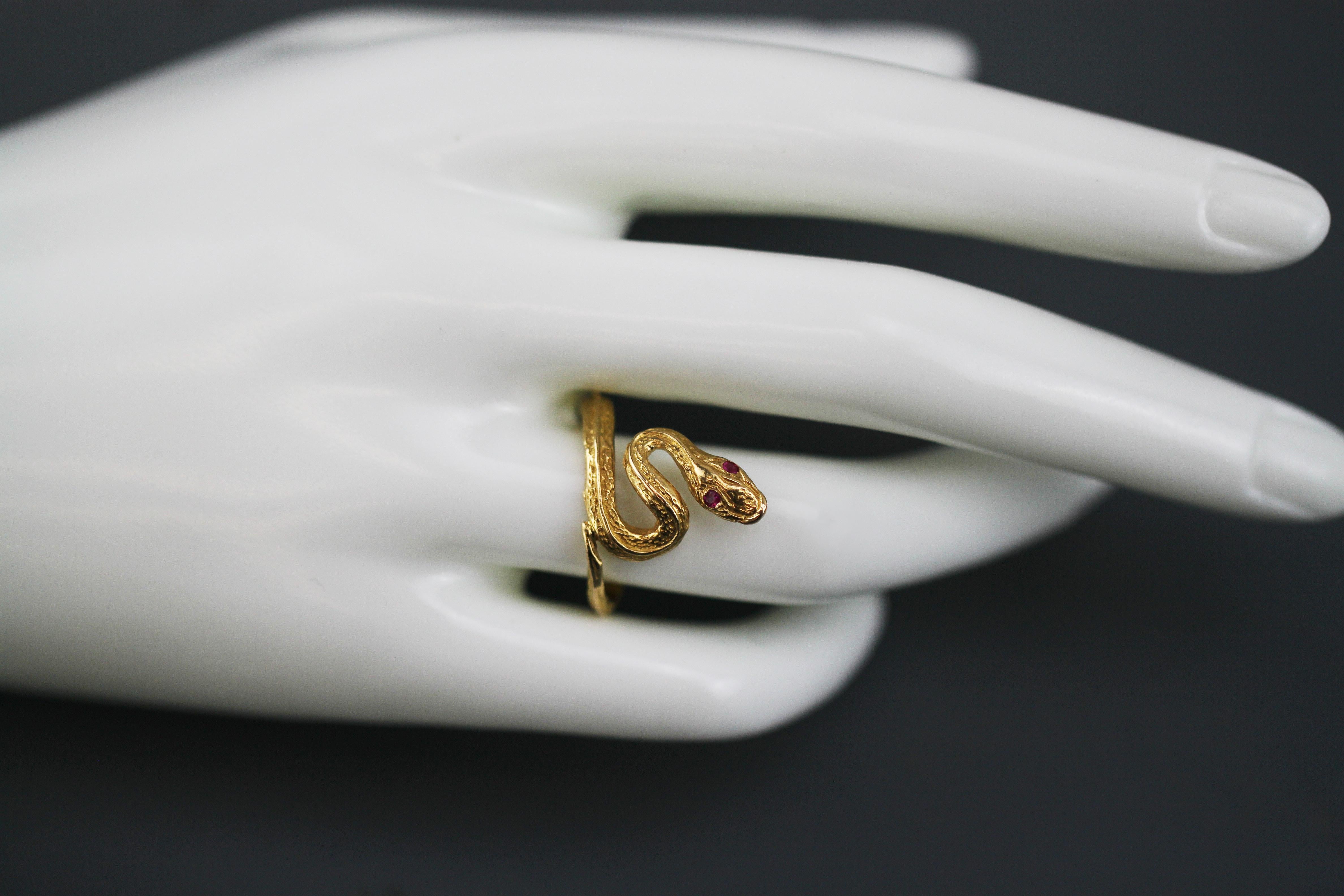 Antique 19th century 18kt yellow gold Egyptian snake ring with 2 ruby eyes
Fully hallmarked Egyptian 18kt gold
Made in Egypt 19th century

Dimensions -
Finger Size : (UK) = Q (US) = 8 1/2 (EU) = 57 1/2
Size : 2.4 x 2.3 x 1.8 cm
Weight: 5 grams