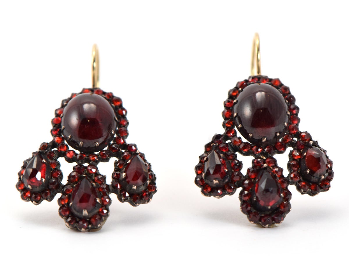 These dark and mysterious beauties are simply stunning.  The garnets are as deep in color as a nice red zinfandel- set into 14k gold.