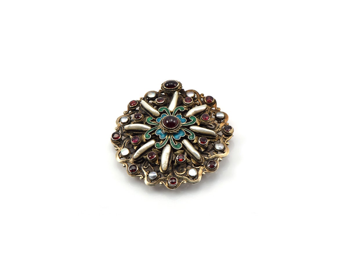 A feast for the eyes!  This brooch is gold gilt over sterling silver... setting Biwa pearls, mother of pearl, garnet, and rich multi-color enamel. Circa 1890s.