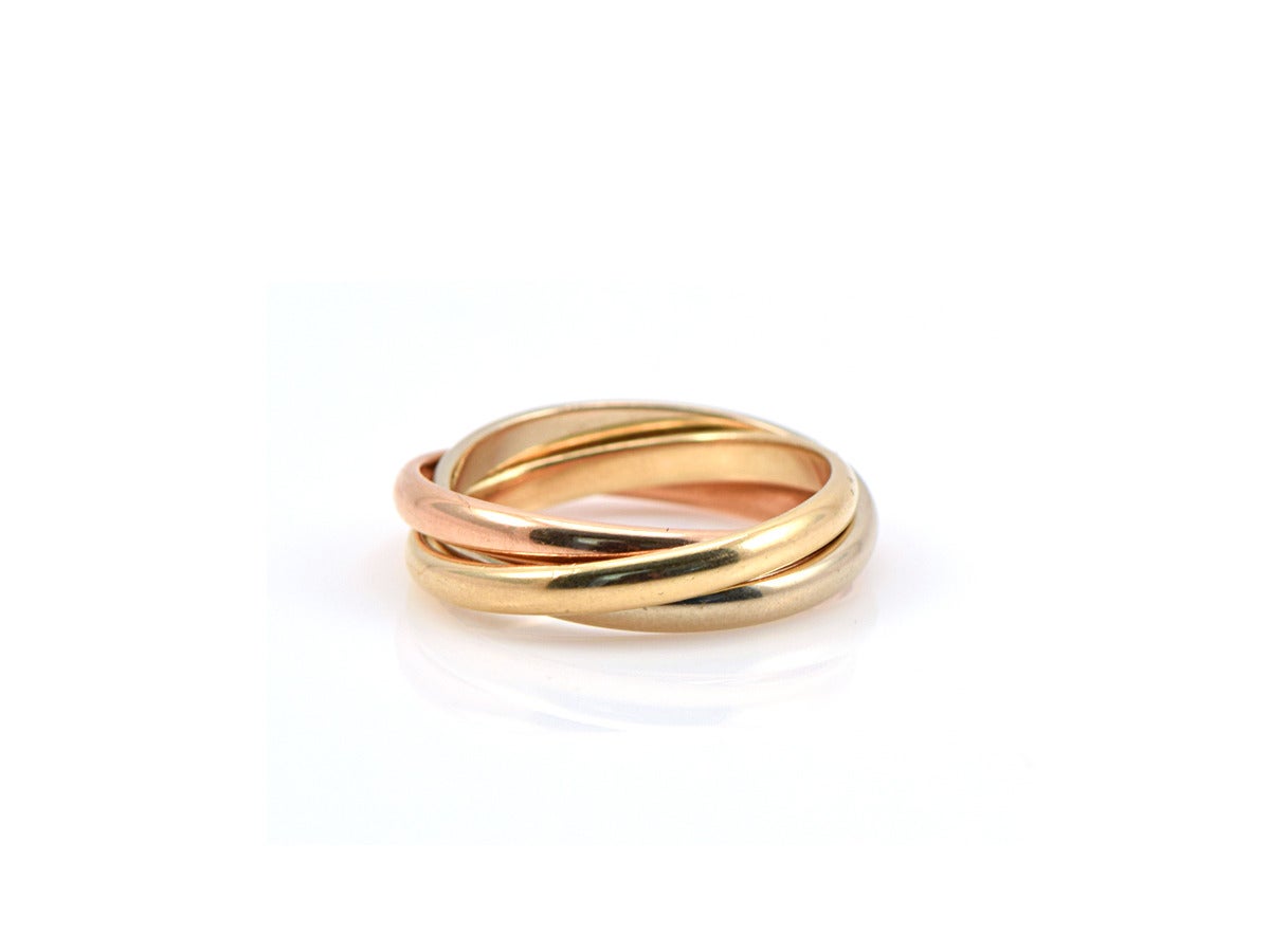 A classic men's tri-color Tiffany band in rose, white, and yellow gold.  Each band is 3mm wide, measures 6mm wide across, and interlocks perfectly.  

Men's ring- size 12.