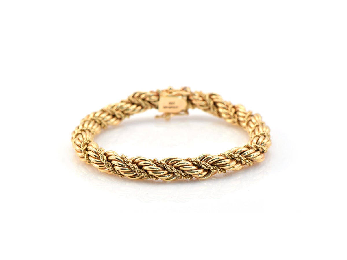 A lovely vintage Tiffany bracelet in 14kt gold, from the 1950s.  

*The rope measures approximately .25 inch wide
*The bracelet measures slightly over 7 inches (standard length)
*Fastened with a secure box clasp and 2 safety closures
