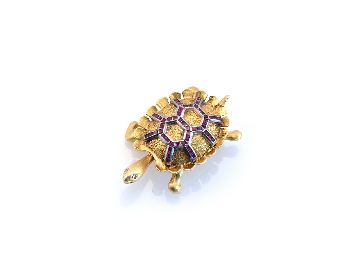 A turtle brooch set with rubies in 14kt gold and platinum. 

*white rose cut diamonds set into the eyes