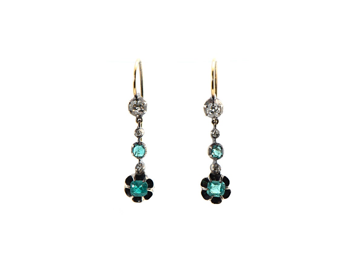 A special pair of Georgian earrings setting emerald cushion cuts and old mine cut diamonds.  The stones are set into sterling silver and 14k yellow gold. 

*total length is 1.3 inches
*emeralds are rich in color 
*clarity is crystal clean, with