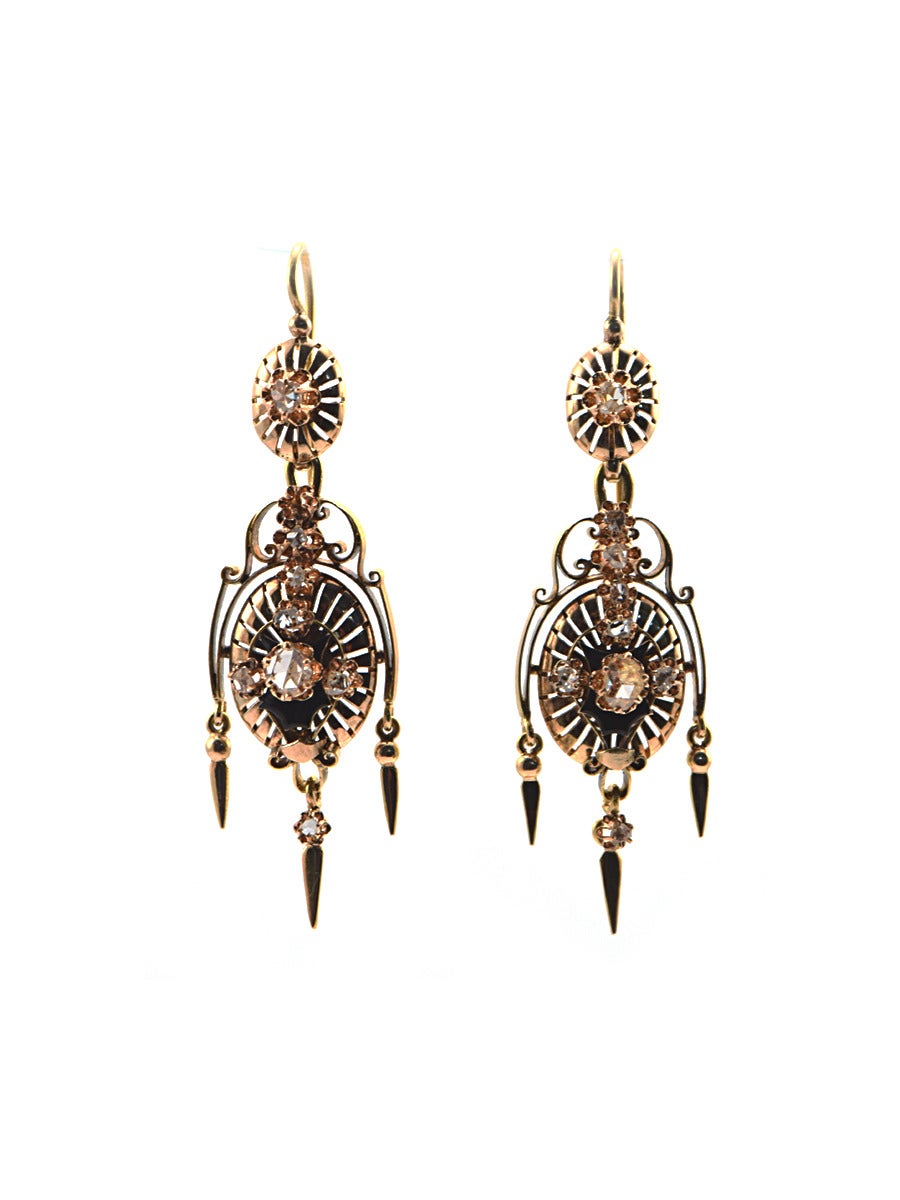 Exceptional beauties!  These earrings have depth and detail, using bright rosecut diamonds and accentuated with black enamel.  The form is recognizable as Victorian, from the 
