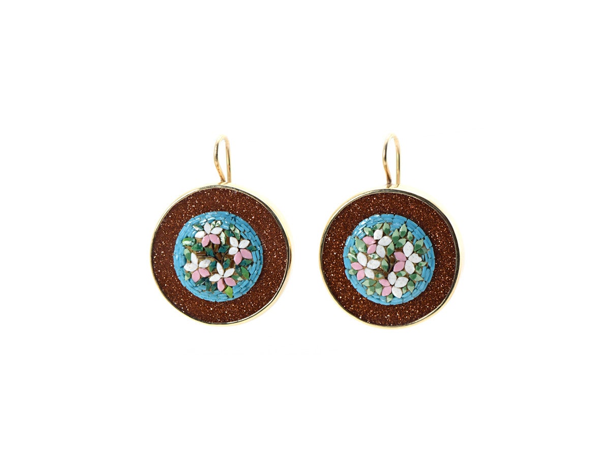 A miniature work of art!  The gold disk earrings feature a beautifully arranged mosaic bouquet and are framed with rich, sparkly goldstone in 14kt gold and sterling silver. 

*Mosaic glass
*Goldstone
*14kt gold
*Sterling silver 
*Victorian Age