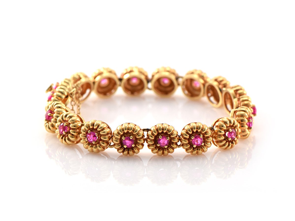 Summer loving and it's raining rubies! Each individual link is set with crystal clean bright red rubies, approximately 2 carats total. 

*prong set rubies
*18k yellow gold
*box clasp with added safety catch