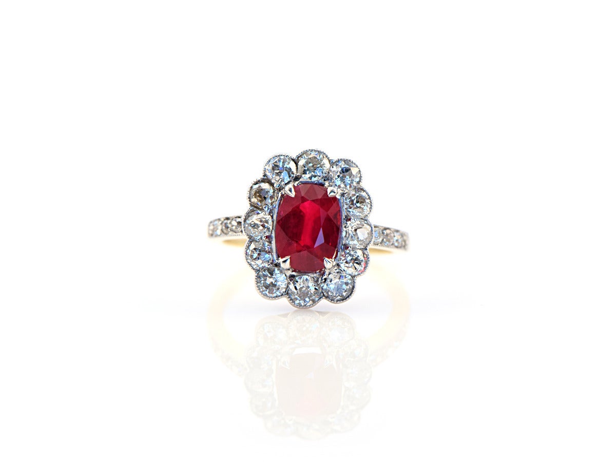 A timeless classic...  This platinum and 14k gold ring sets a natural 1.61ct Burmese ruby with approximately 1ct antique European diamonds. 

*ring size 5.5
*Burmese ruby weighs 1.61 ct
*1 ct of F/G VS diamonds