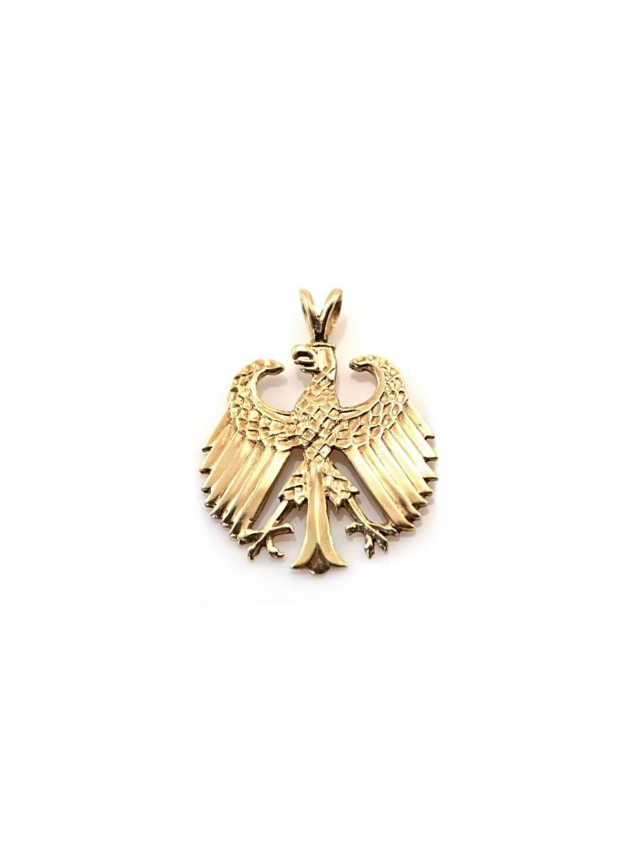 An emblem of America...this gold eagle is stylized in the Art Deco fashion and created in solid 14kt gold. 