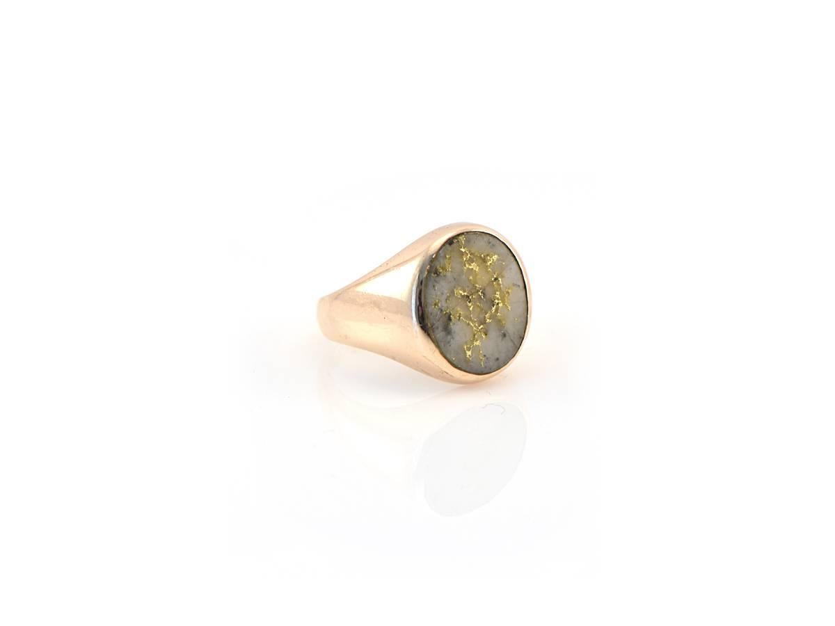 An incredibly handsome pure gold-in-quartz gentleman's ring set into 10kt gold. 

*Ring size 9