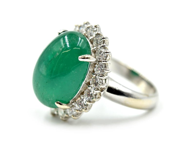 Modern 10.33 Carat Cabochon Cut Emerald Gemstone with Diamond Halo Ring For Sale