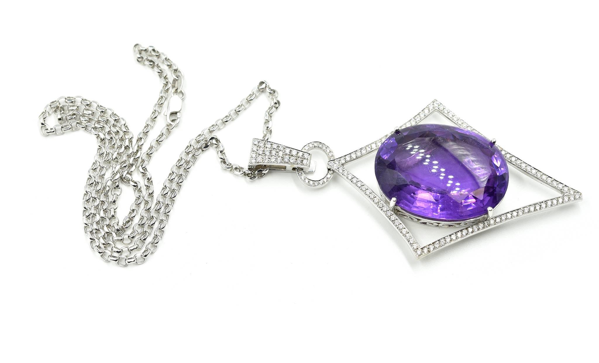 This is a fantastic design! Featured is a jaw-dropping oval mixed cut 53ct amethyst prong set in the 14k white gold navette-shaped pendant! The pendant is shaped like an arrow pointing down, measuring 81.30mm from the bottom of the pendant to the