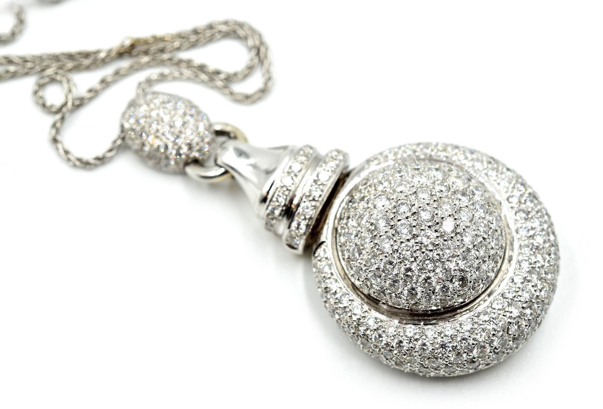Designer: custom design
Material: 18k white gold
Diamonds: 6.48 total carat weight
Color: G
Clarity: VS
Dimensions of Pendant: 1 ¼ inches long x 1 ¾ inches in height 
Necklace: 16 inches long
Weight: 29.7 grams


