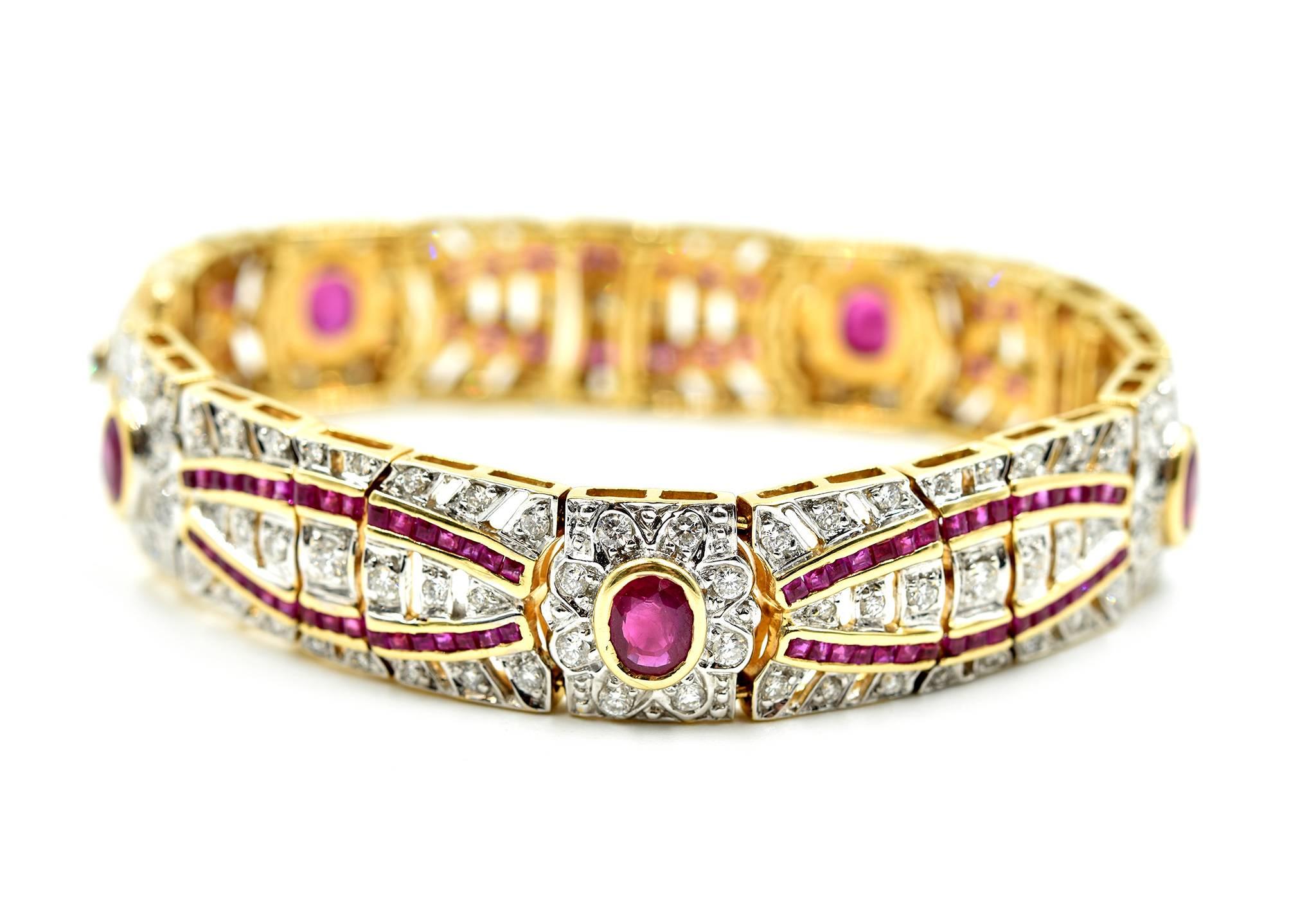 This bracelet is made in solid 18k yellow gold and set with rubies and diamonds. The diamonds have a total weight of 3.10 carats, and they are graded H-I in color and SI in clarity. The rubies have an additional weight of 9.75 carats—stunning! The