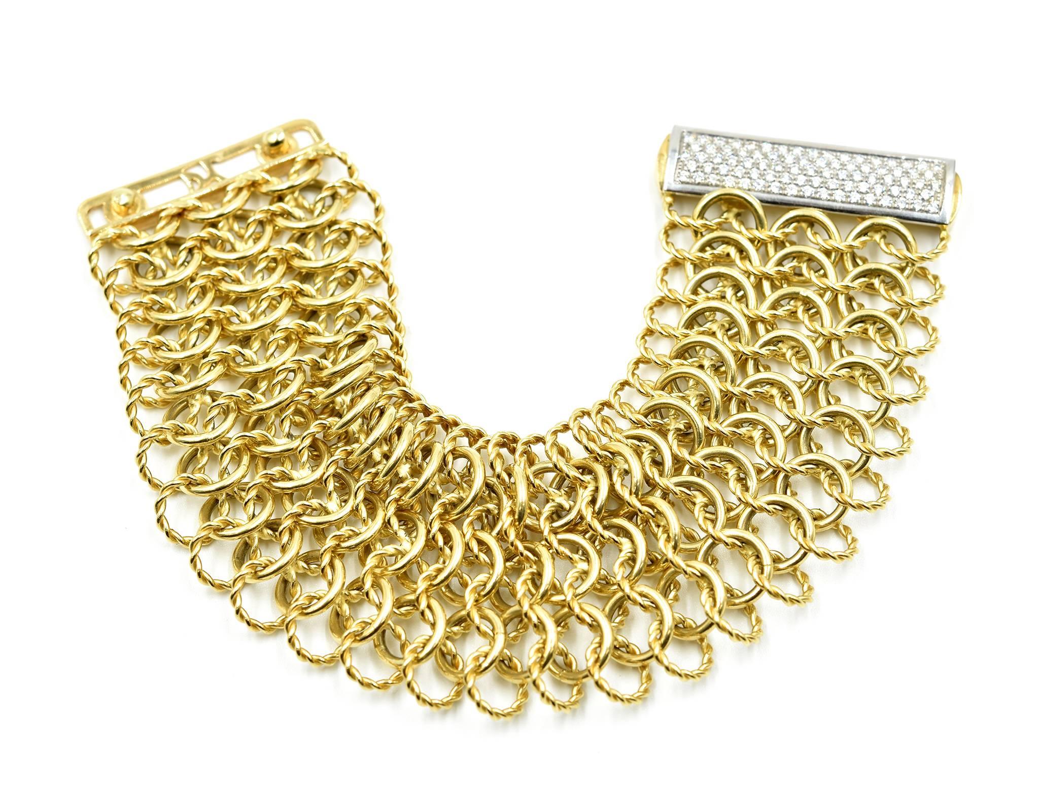 Designer: David Yurman
Collection: Quatrefoil
Material: 18k yellow gold
Diamonds: round brilliant 1.00 carat total weight
Color: G-H
Clarity: VS
Dimensions: 7 ¼ inches long x 1.75 inches wide
Weight: 75.90 grams
