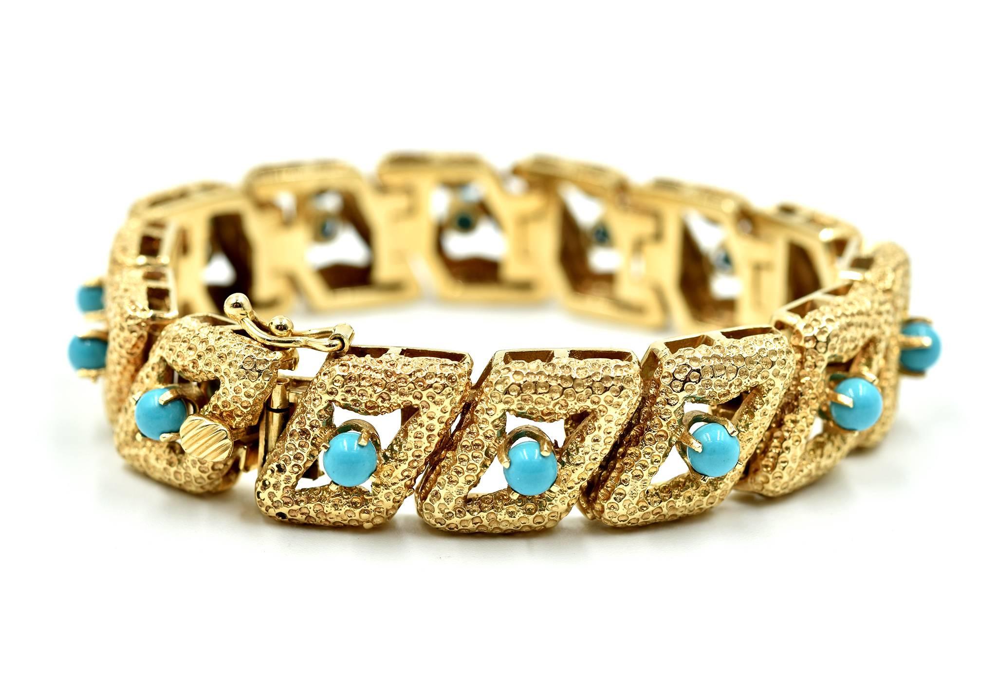 Designer: custom design
Material: 14k yellow gold
Turquoise: round balls of Persian blue turquoise
Dimensions: bracelet is 7 inches long and ½ inch wide
Weight: 48.42 grams
