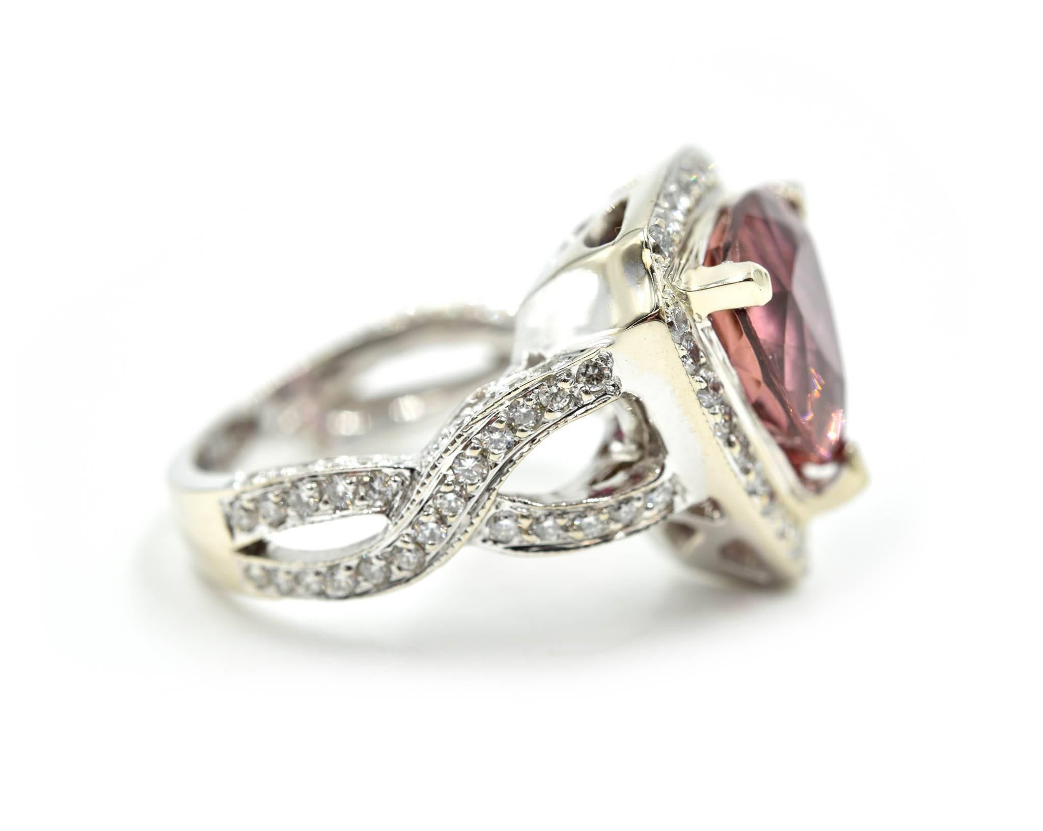 Designer: custom design
Material: 18k white gold
Center Stone: trilliant cut 4.50 carat pink tourmaline 
Diamonds: round cut 1.44 carat total weight
Color: G-H
Clarity: VS
Ring Size: 7
Weight: 14.28 grams
