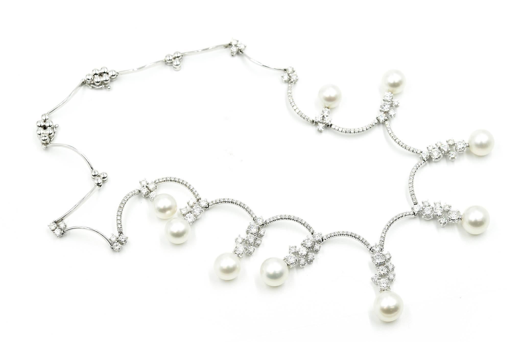 This beautiful necklace is designer in 18k white gold by Stefan Hafner. The necklace is set with 6.00cttw round brilliant diamonds and beautiful natural white pearls. The diamonds are graded G-H in color and VS-SI in clarity. The pearls range in