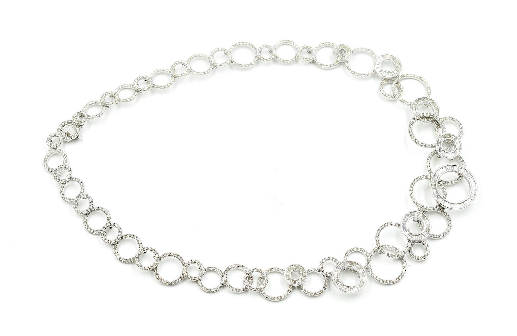 Dazzling diamonds on your neck! This is a 18k white gold circle linked necklace with round and baguette diamonds. The diamonds amount to 975 round diamonds and 250 baguette diamonds. The diamonds weigh 13.44 carats. The round diamonds are prong set